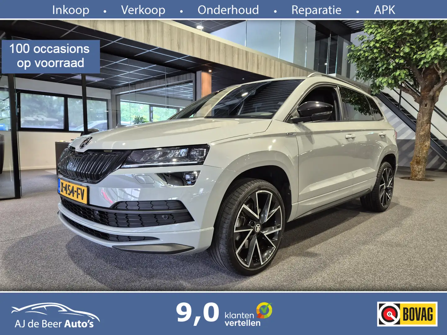 Skoda Karoq 1.5 TSI ACT Business Edition Sportline DSG | Virtu Grijs - 1