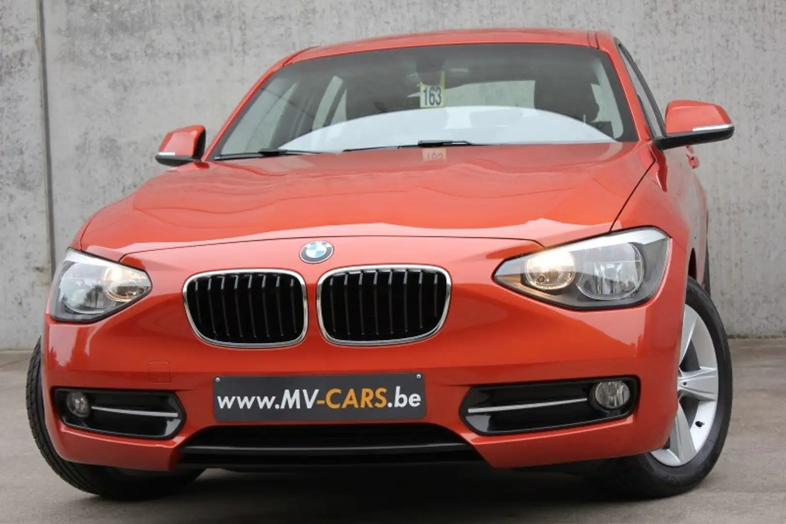 BMW 116 BMW 116i/5-deur/sport/pdc/navi/multistuur... Oranje - 1