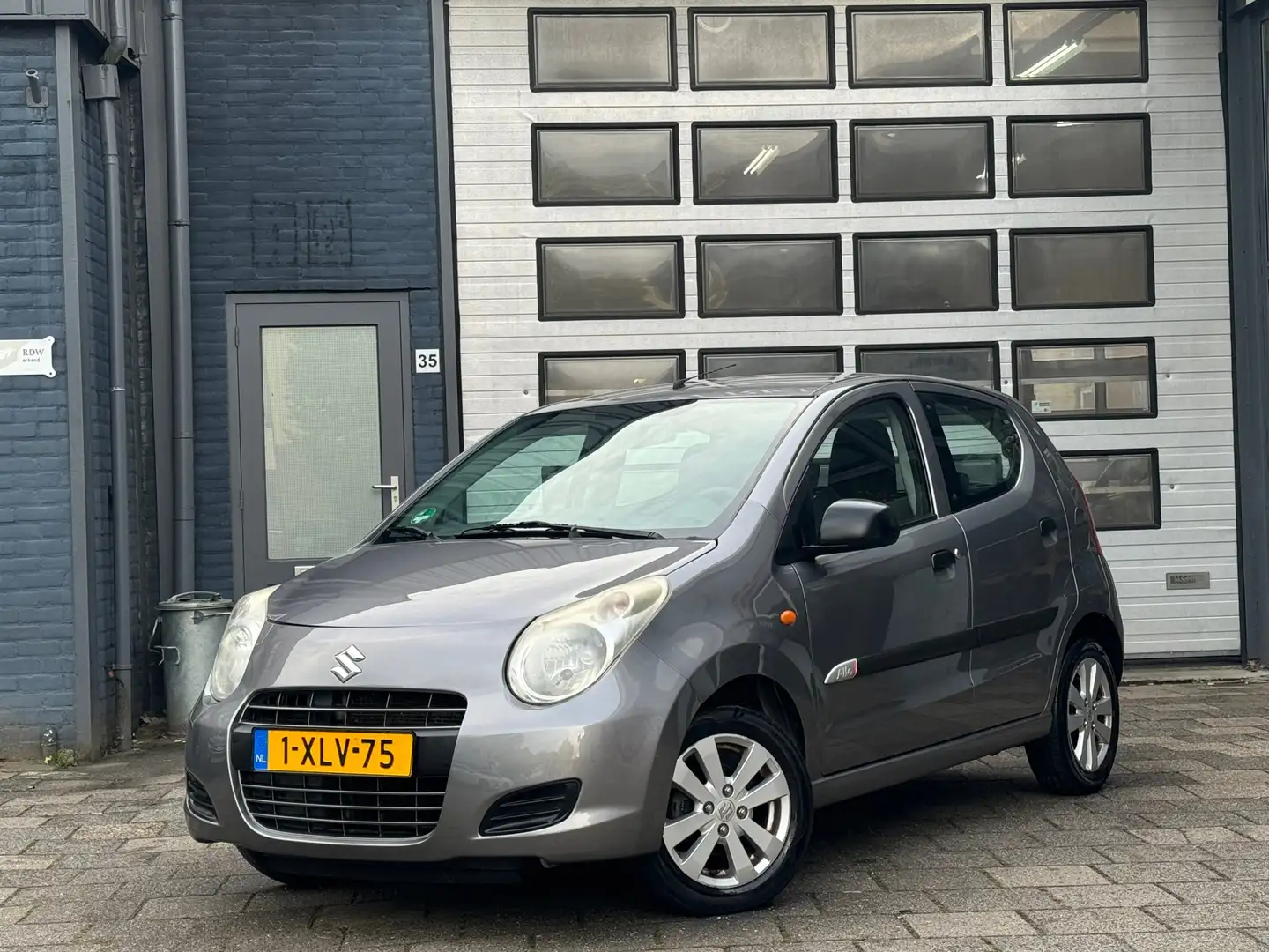 Suzuki Alto 1.0 Celebration VVT | Airco | Automaat | N.A.P Gris - 1