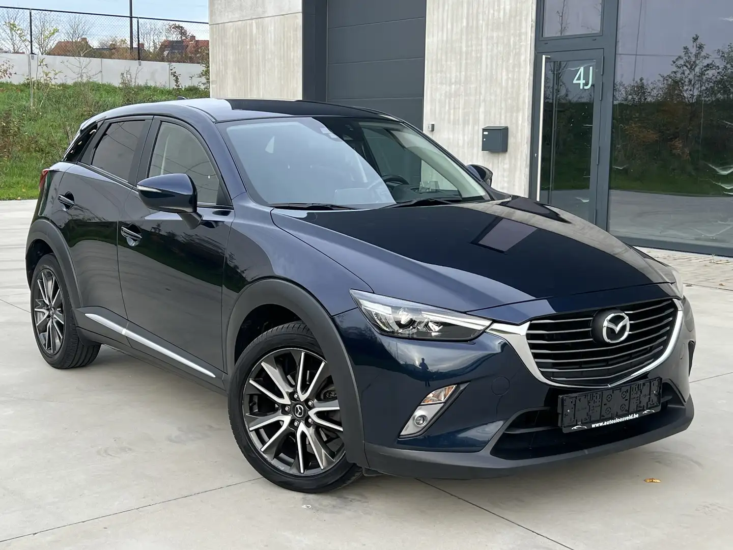 Mazda CX-3 2.0i AUTOMAAT Euro 6b/ NAVI/ CAMERA/ KEYLESS/ LED Blauw - 1