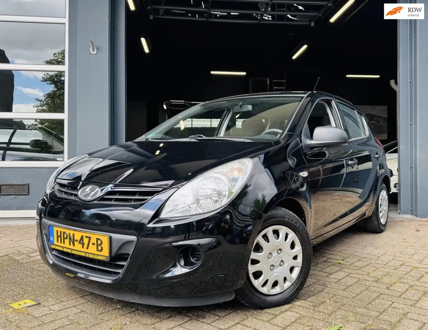 Hyundai i20 1.2i i- Drive *AIRCO*ELEKTR. RAMEN*5DRS*STUURBEKR. Zwart - 1