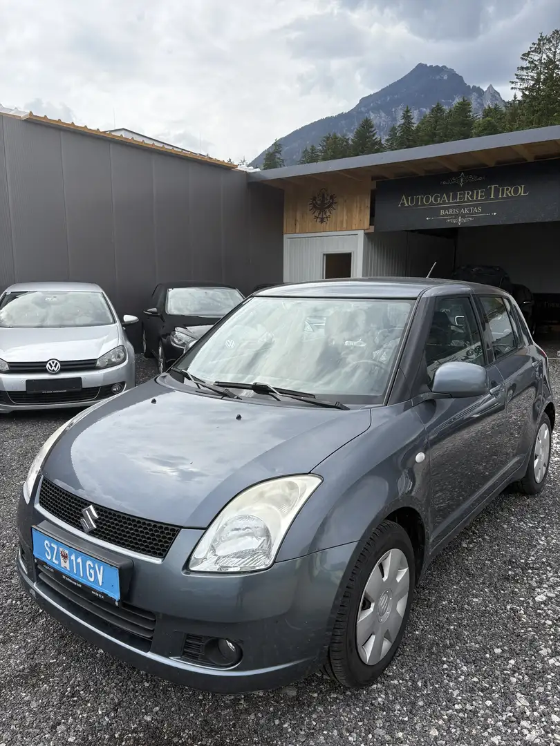 Suzuki Swift 1,3 GL 4WD Grijs - 1