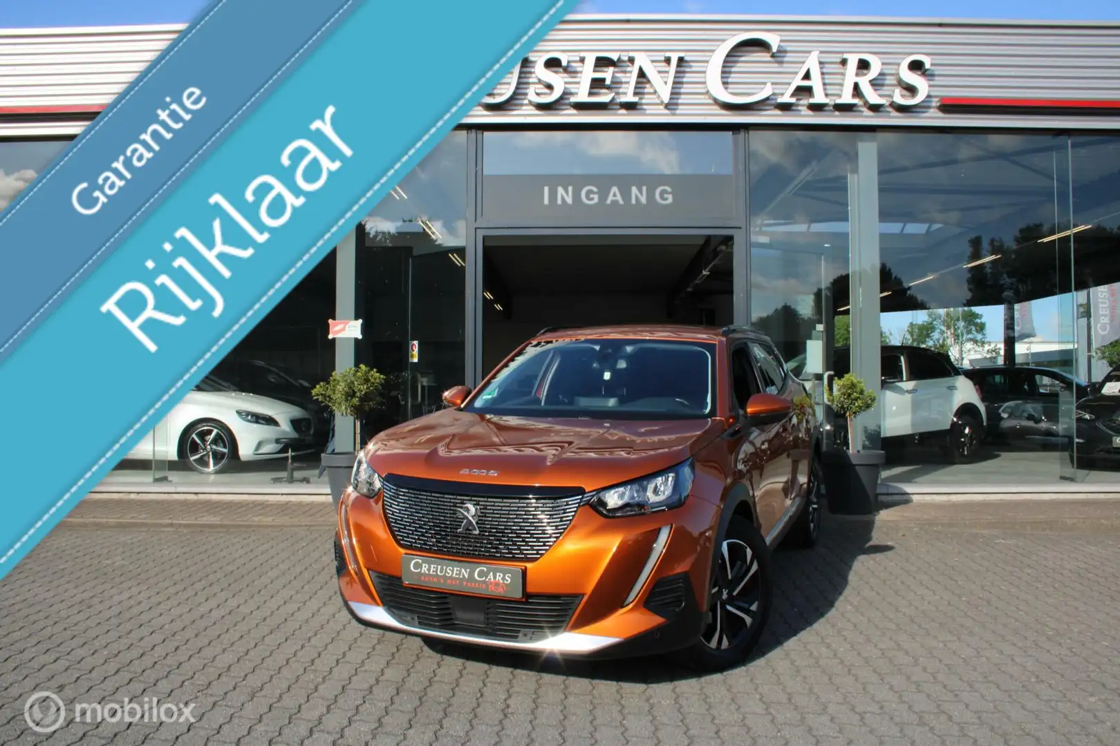 Peugeot 2008 1.2 PureTech Blue Lease Allure/Led/Navi/Cam/ Orange - 1