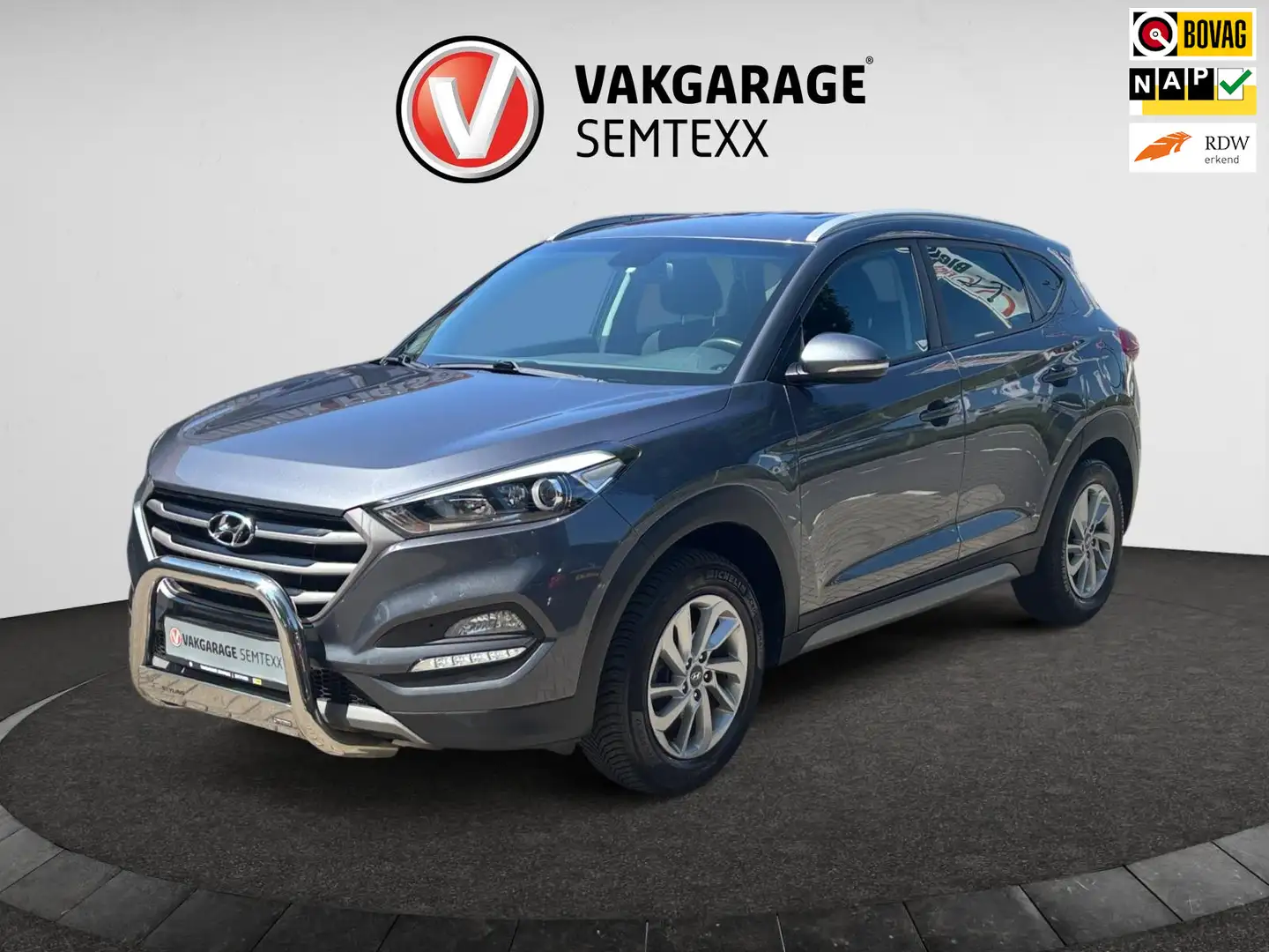 Hyundai TUCSON 1.6 GDi Comfort | Clima | Cruise | Navi | Camera | Grijs - 1