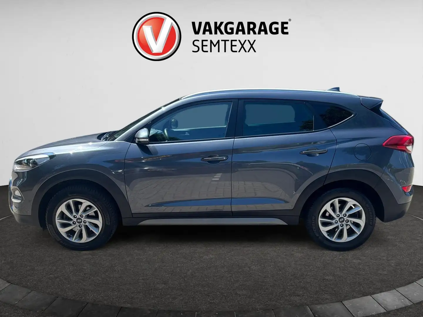 Hyundai TUCSON 1.6 GDi Comfort | Clima | Cruise | Navi | Camera | Grijs - 2