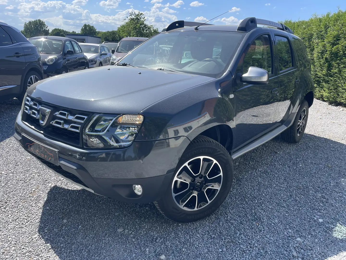 Dacia Duster 1.2 TCe 4x2 Prestige Navi Camera Airco Euro6b Grijs - 1