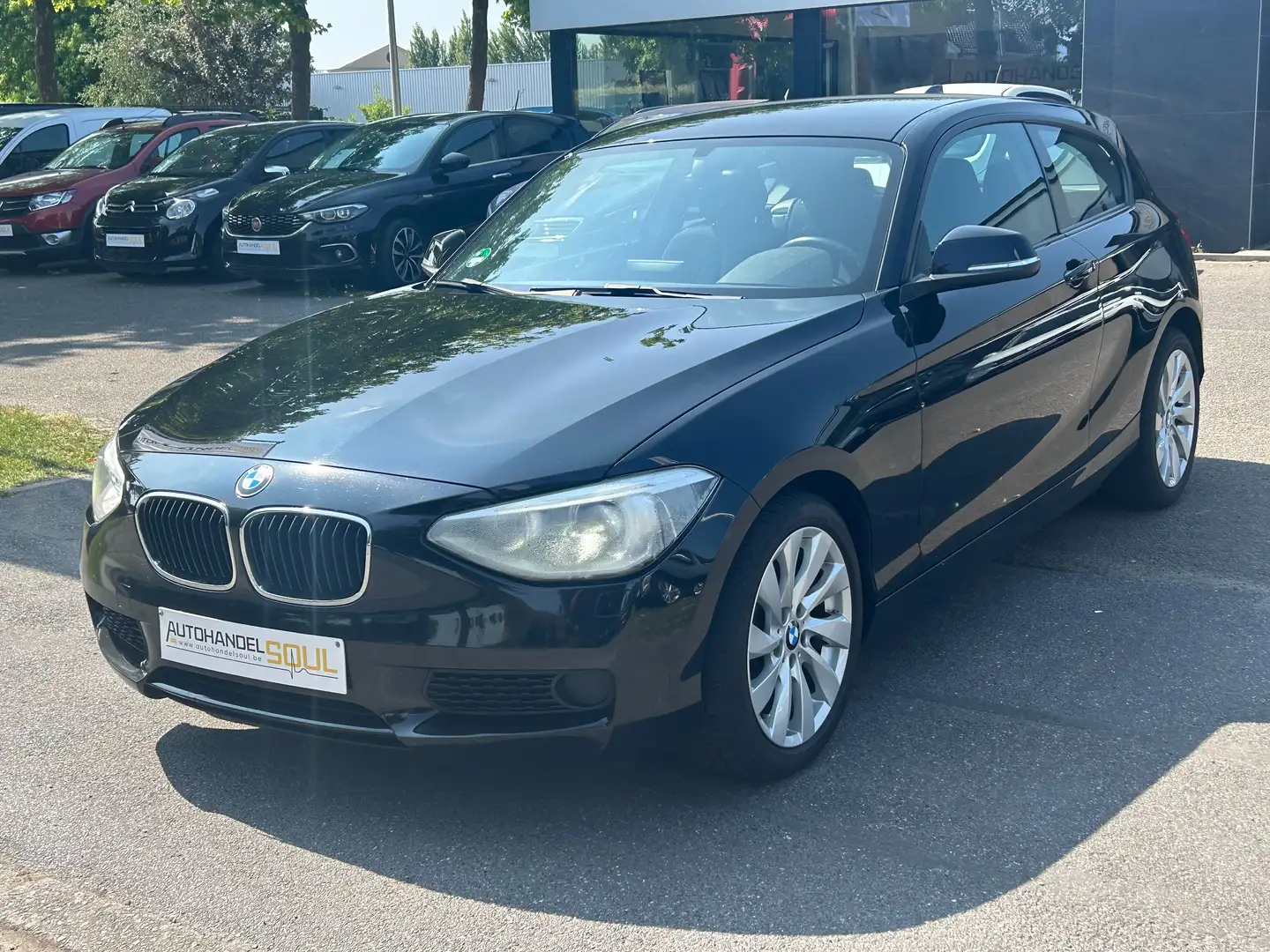 BMW 116 2013, 166.805km, Airco, PDC, Keuring, 12m Garantie Zwart - 1