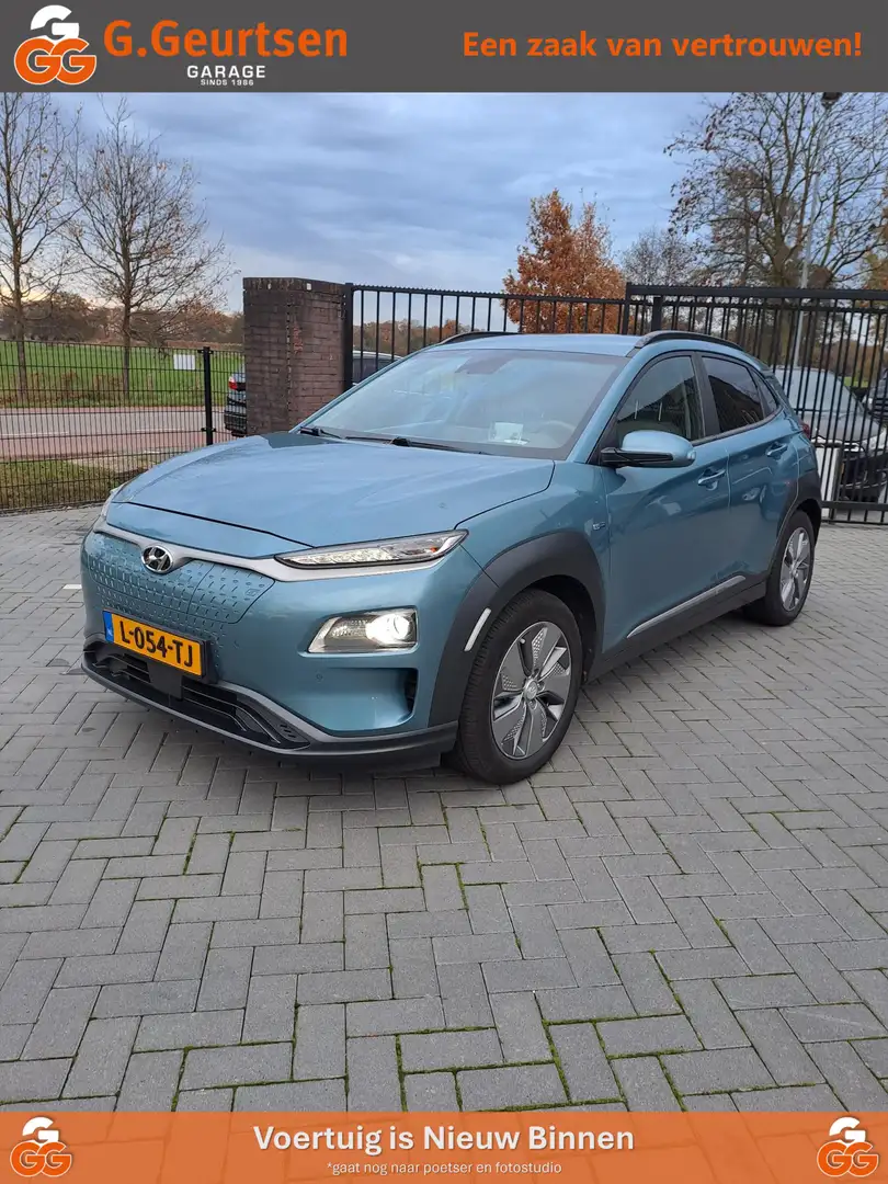 Hyundai KONA EV Premium 64 kWh SOH 100%, Blauw - 1
