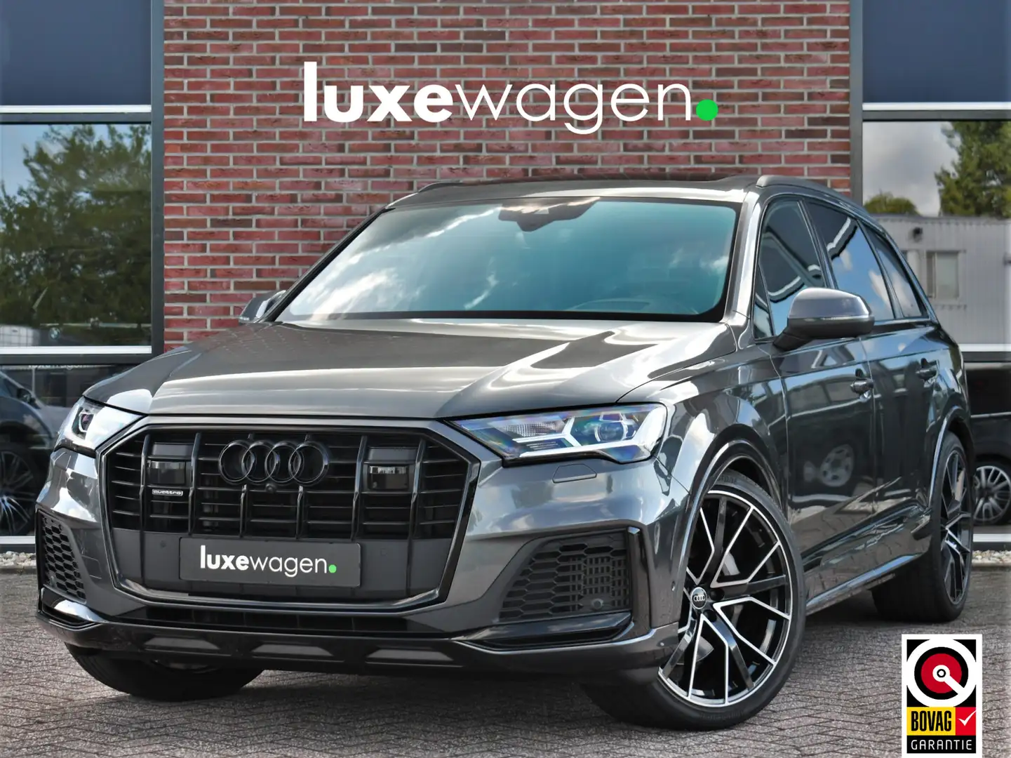 Audi Q7 55 TFSI quattro S-Line 7-persoons Pano S-zetels Tr Grijs - 1