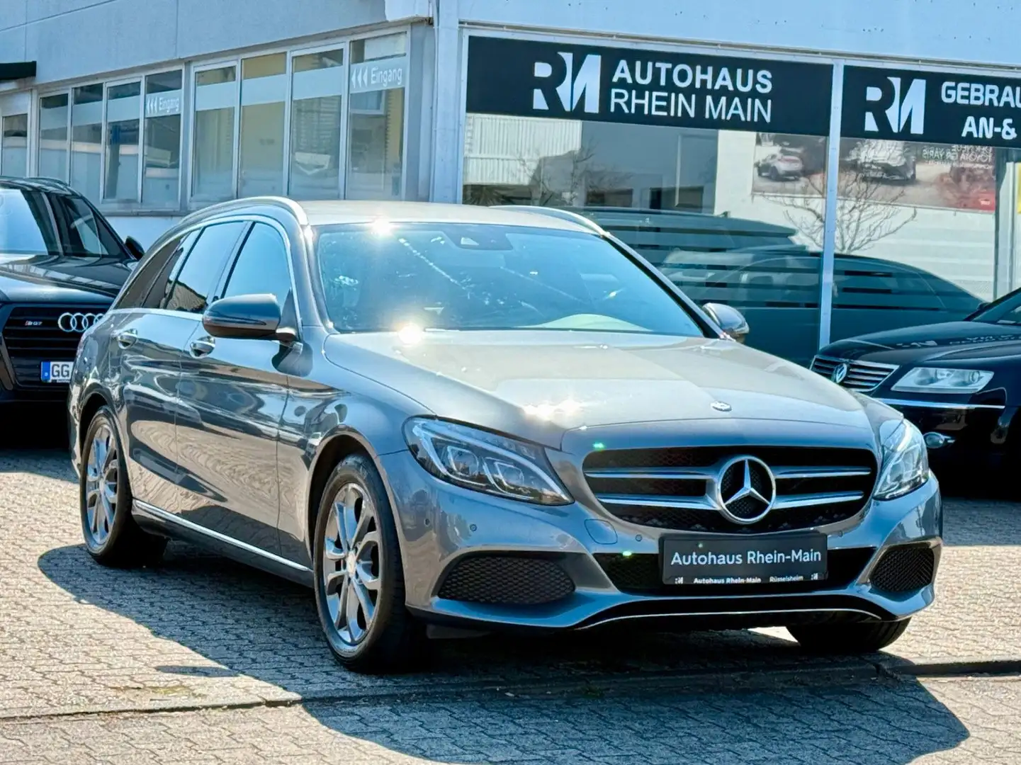 Mercedes-Benz C 200 T Aut.*Nav*Led*Cam*T-Leder*Shz*1.Hand Grijs - 1