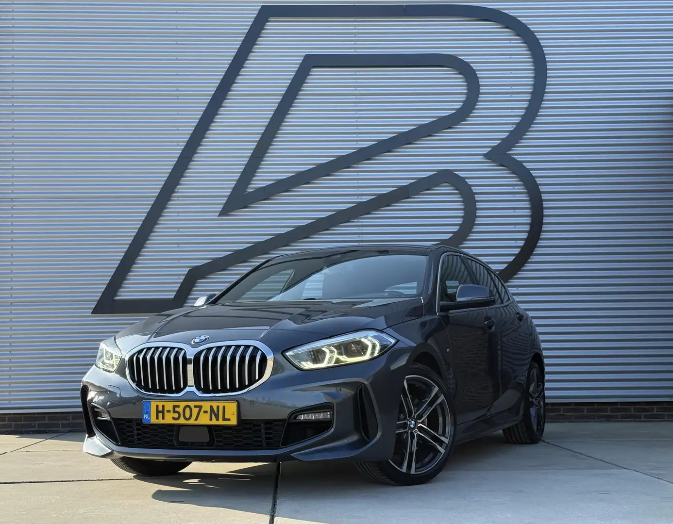 BMW 118 1-serie 118i High Executive Edition M-Pakket,2e Ei Gris - 1
