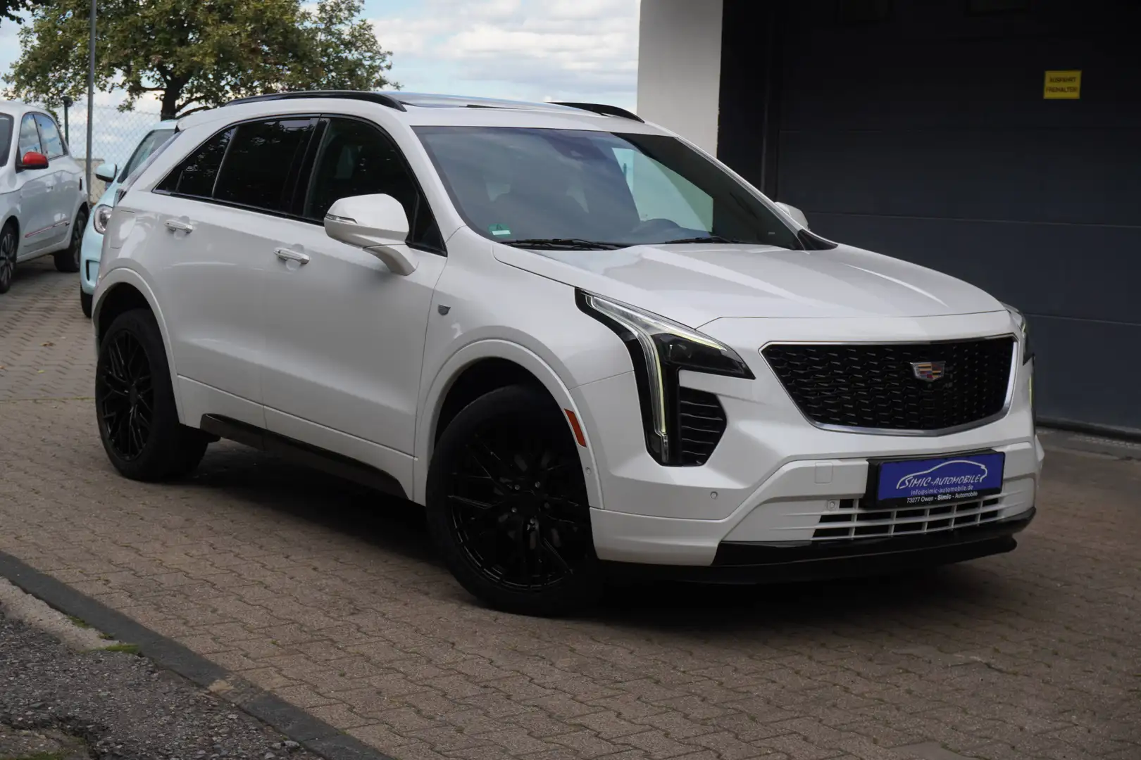 Cadillac XT4 Sport 2.0 TD LEDER+NAVI+PANORAMA+KAMERA+AHK+ALU+71Tkm Weiß - 1