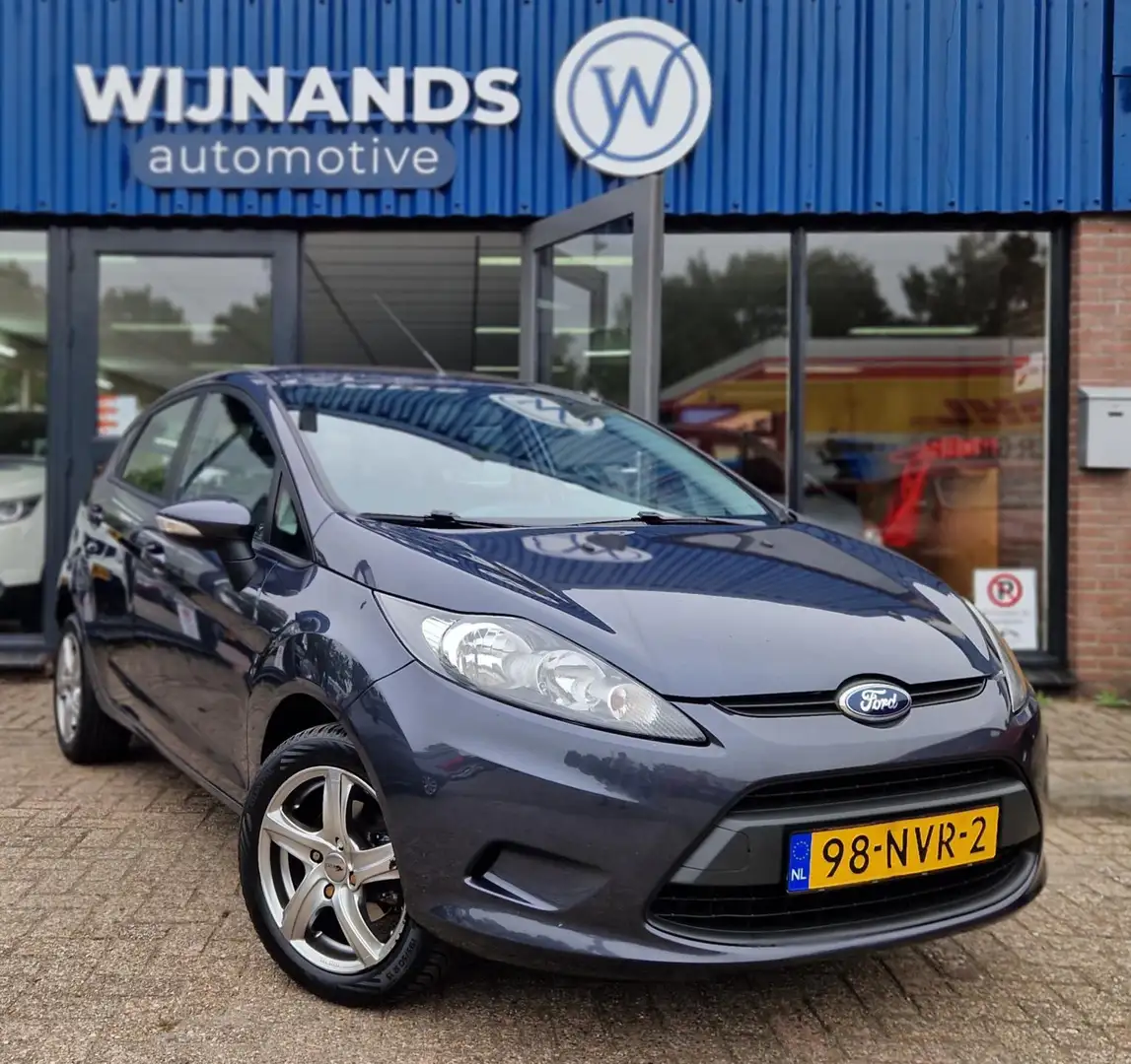 Ford Fiesta 1.25 Limited Airco Elekt ramen Lm Velgen APK Gris - 1