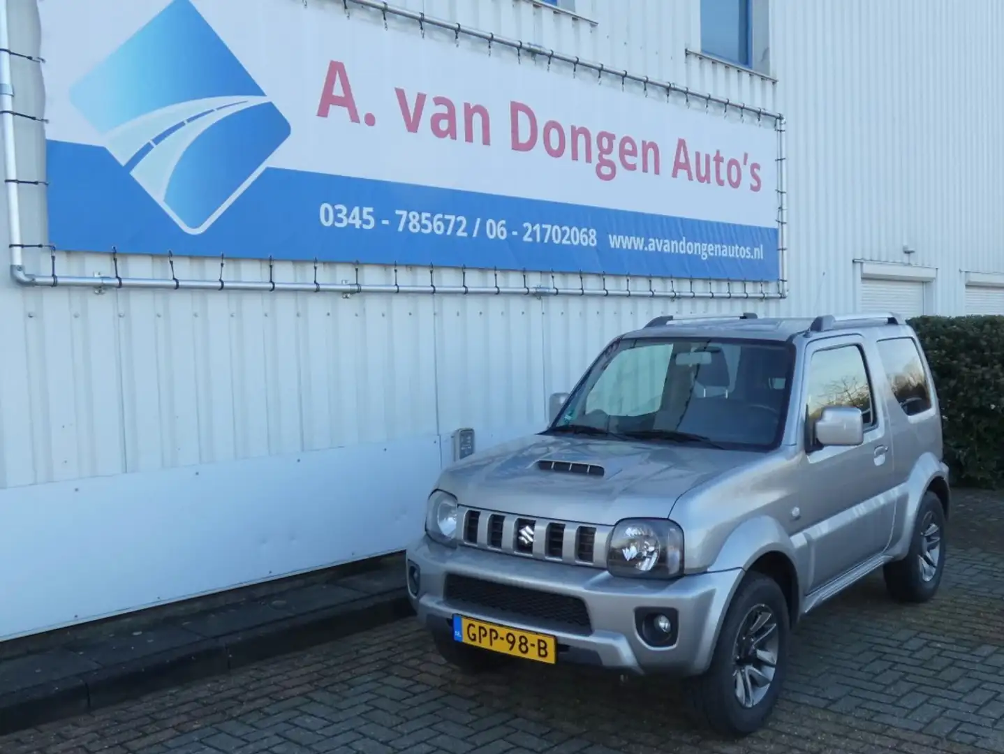 Suzuki Jimny 1.3 EXCLUSIVE 4WD,Leer,Stoelverw,1e Eignr,Trhaak Gris - 2