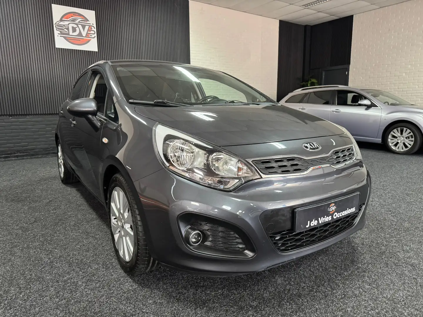 Kia Rio 1.2 CVVT, PDC, STL VERW,STUUR VERW, ELEK PAKKET Grijs - 2