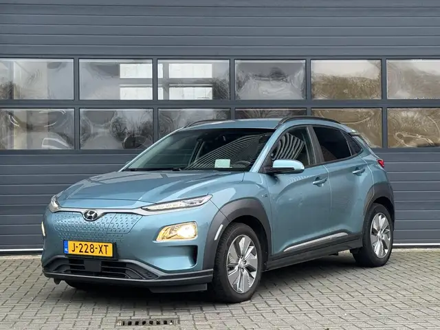 Hyundai KONA EV FASHION 64 KWH I 3 FASE I 100% SOH I P-CAMERA I
