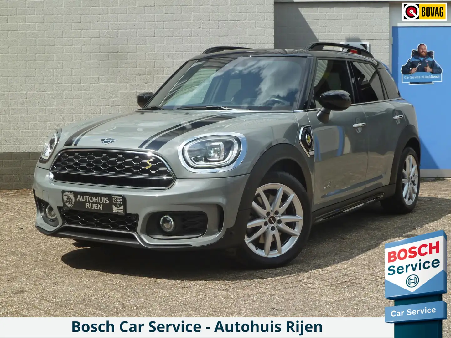 MINI Cooper S Countryman E ALL4| JCW-Pakket|Head-Up|Harman/Kardon|Adaptive- Grijs - 1