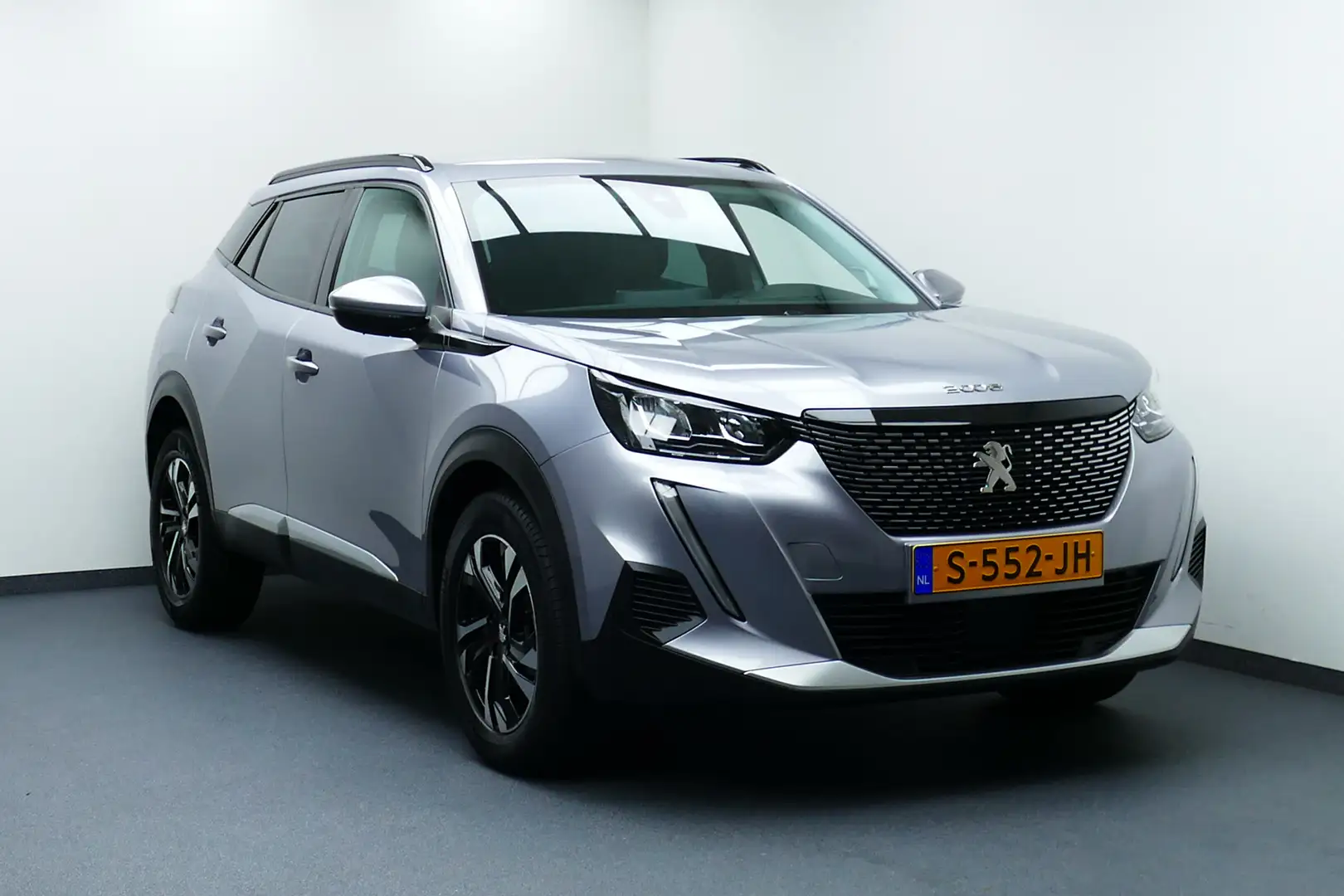 Peugeot 2008 1.2 Allure Pack. Camera, Navi, Clima, Cruise, Half Grau - 1