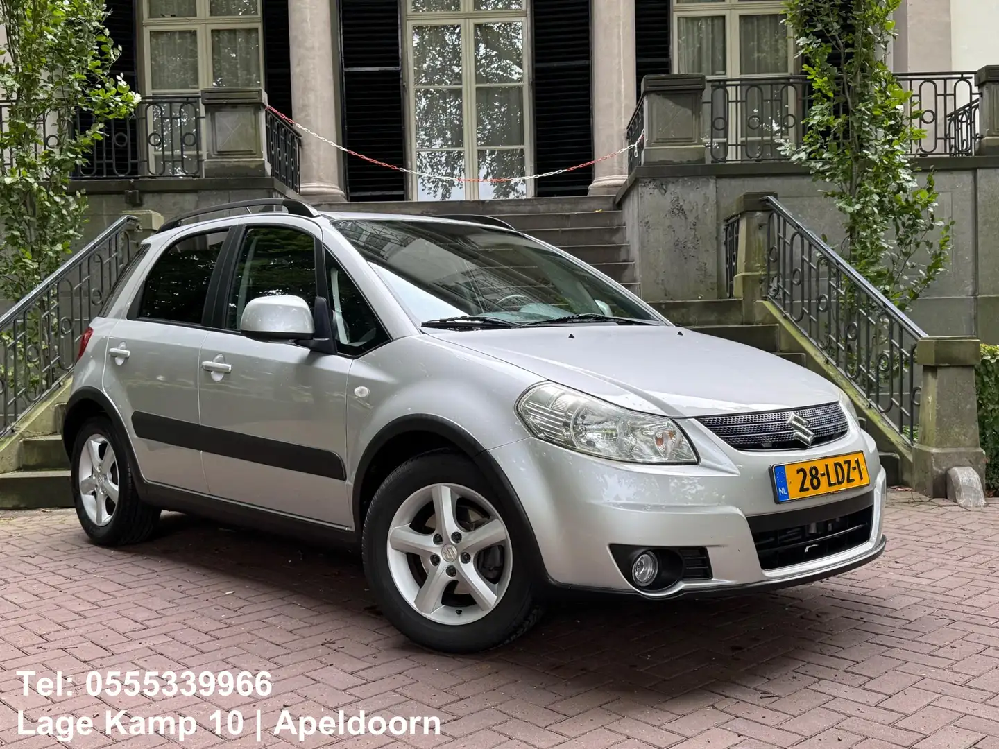Suzuki SX4 1.6 Shogun Airco Elec Pakket Trekhaak Lmv Dakrails Grijs - 1