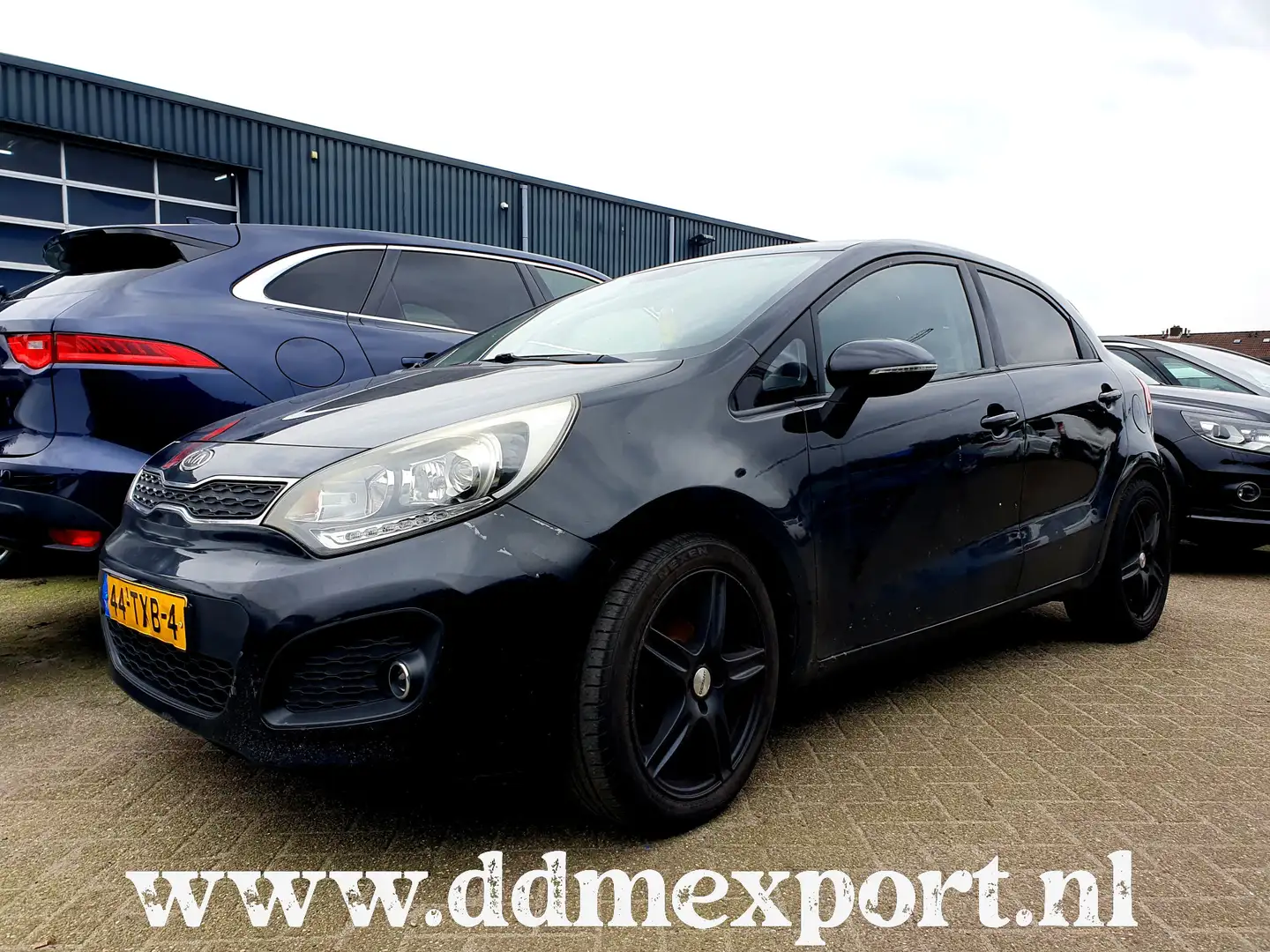 Kia Rio 1.1 CRDi Plus Pack - Motorschade Noir - 1