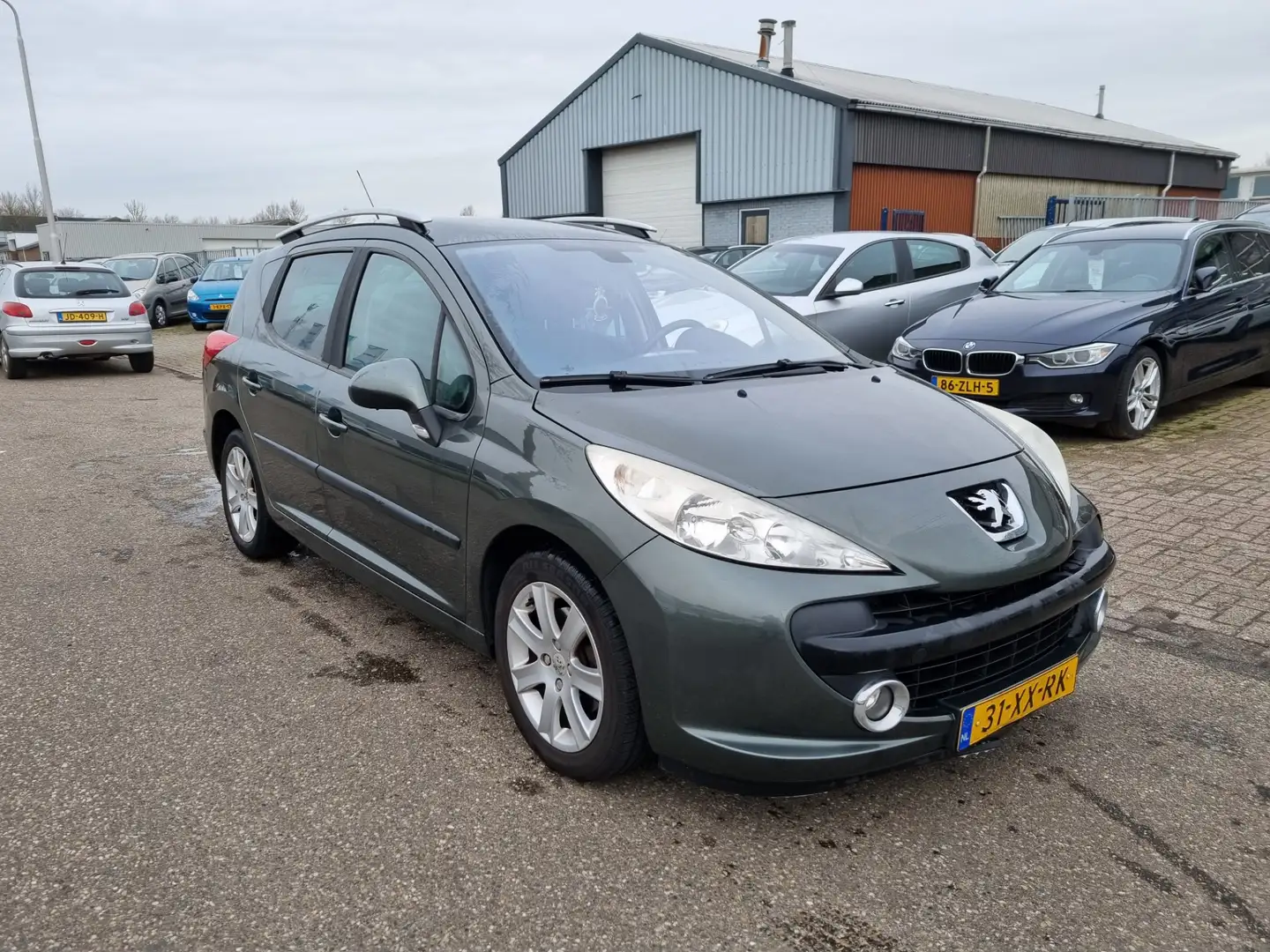 Peugeot 207 SW 1.6 VTi XS Airco Bj:2007 NAP! Grijs - 2