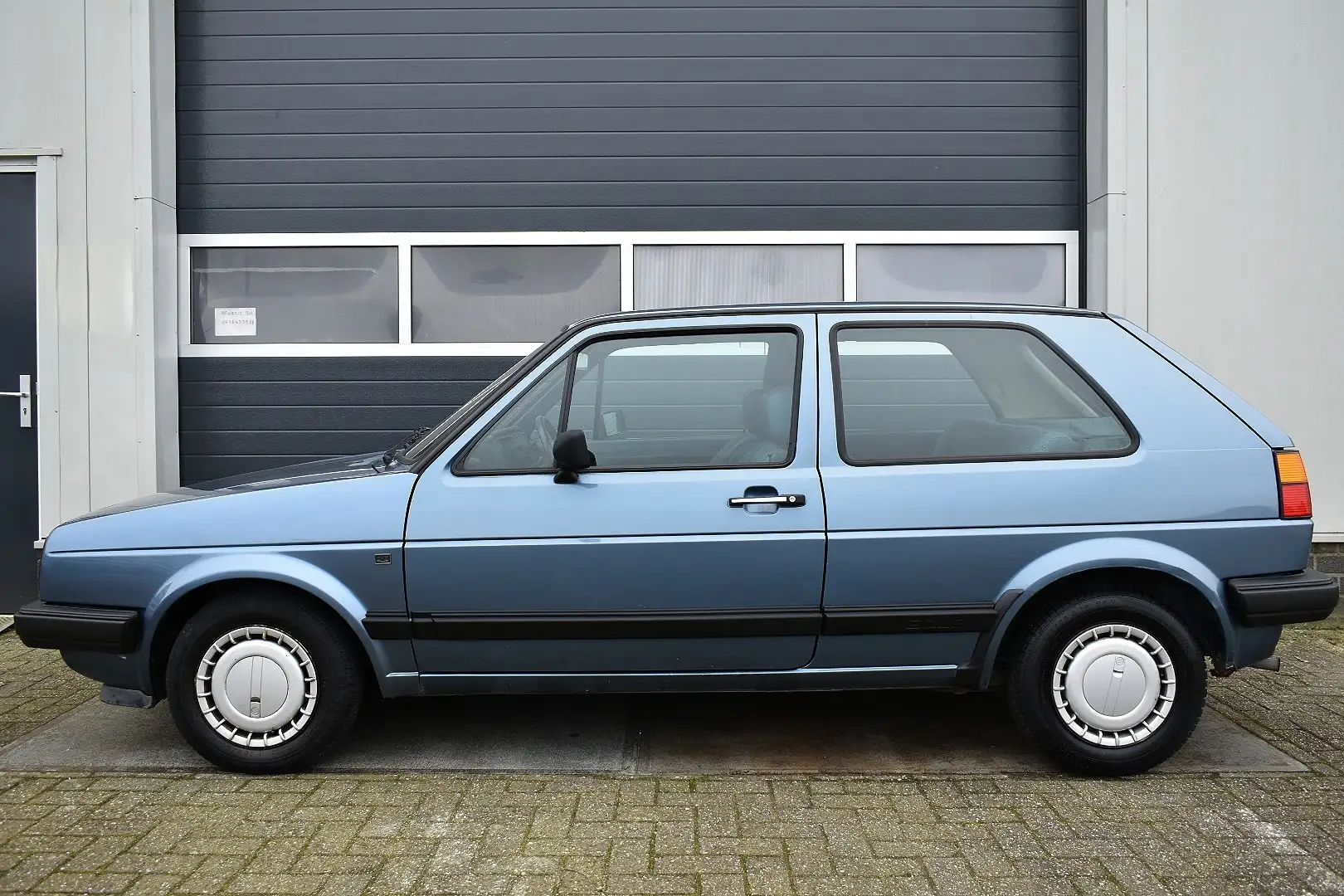 Volkswagen Golf 1.3 uniek Blauw - 2