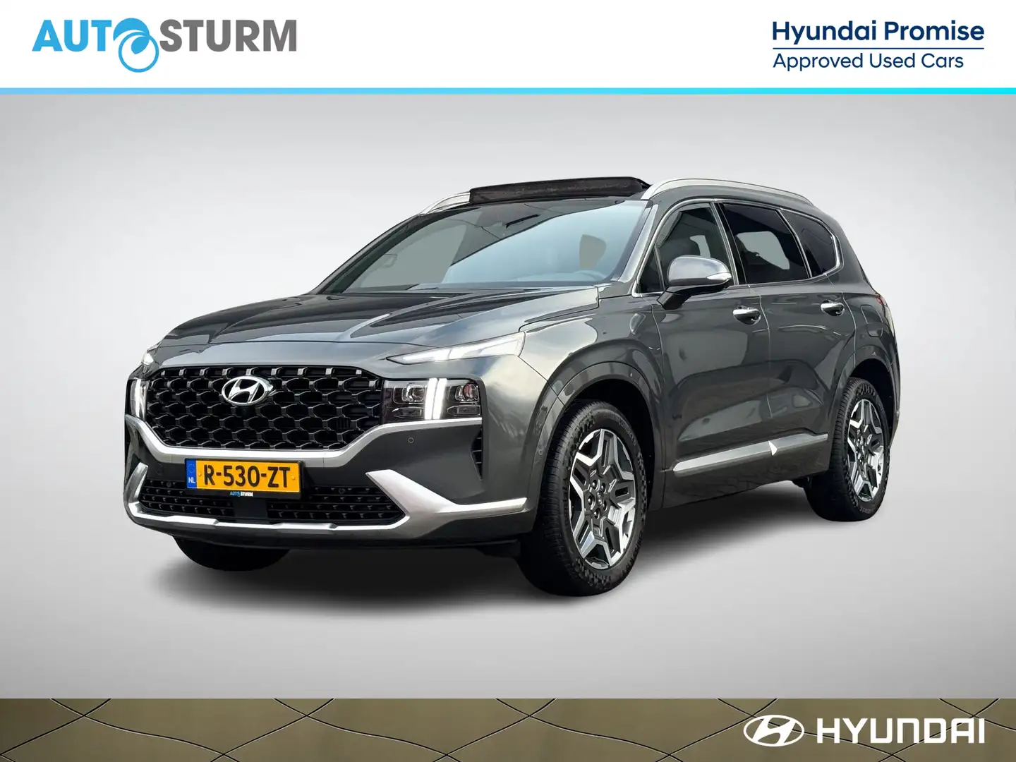 Hyundai SANTA FE 1.6 T-GDI HEV Premium Plus Sky 7p. NL-Auto, Meest Groen - 1