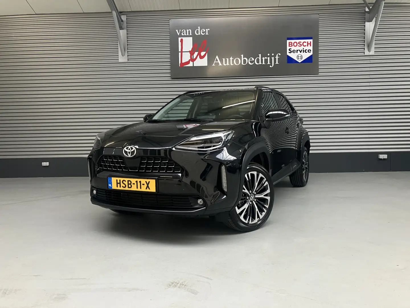 Toyota Yaris Cross 1.5 Hybrid 130 EXECUTIEVE/PDC V+A/EL A KLEP/DODE H Zwart - 1
