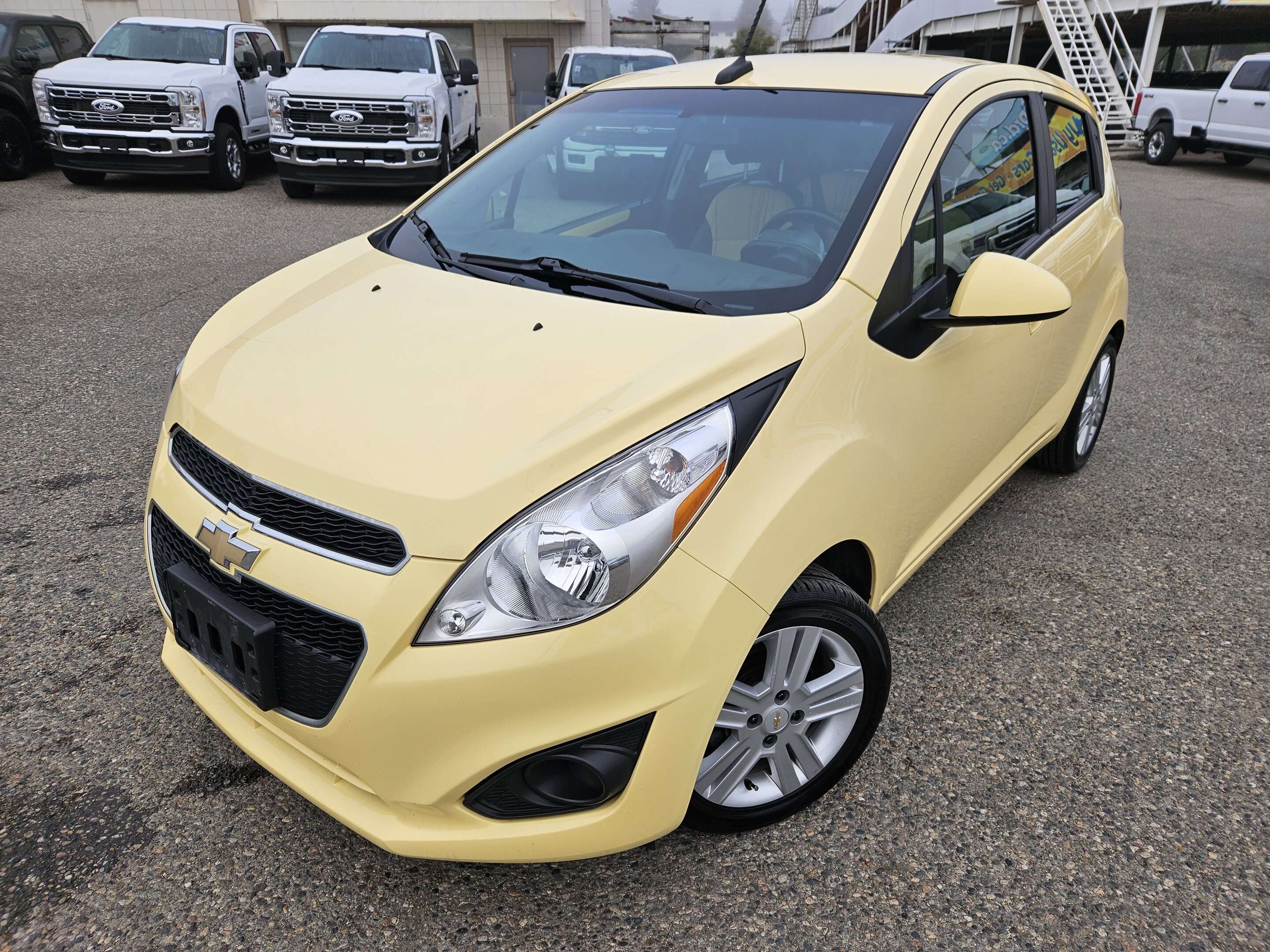 Yellow 2014 Chevrolet Spark Hatchback Front-Wheel Drive 5-Speed Manual