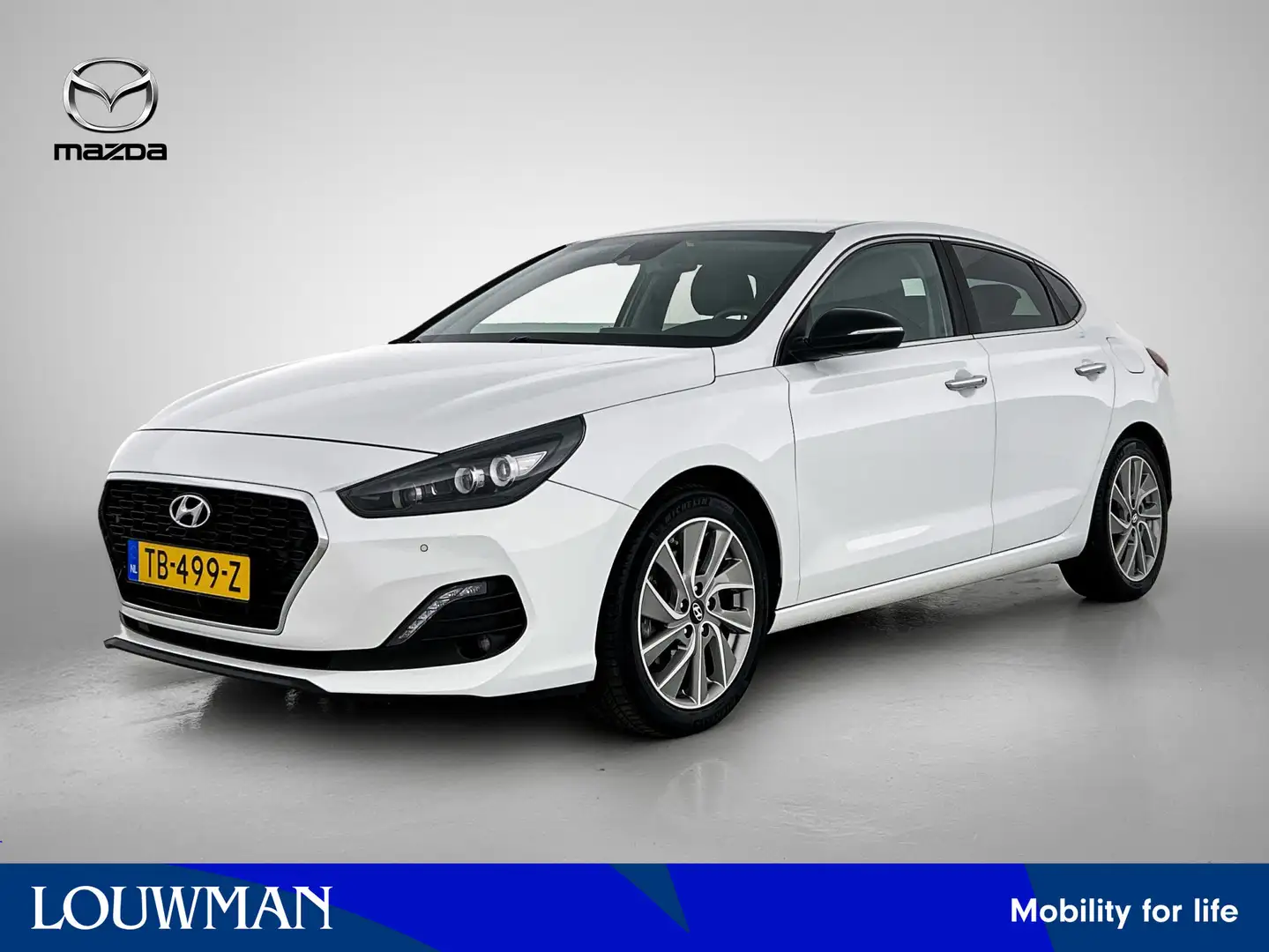 Hyundai i30 Fastback 1.0 T-GDI Premium / Navigatie / Camera / Wit - 1