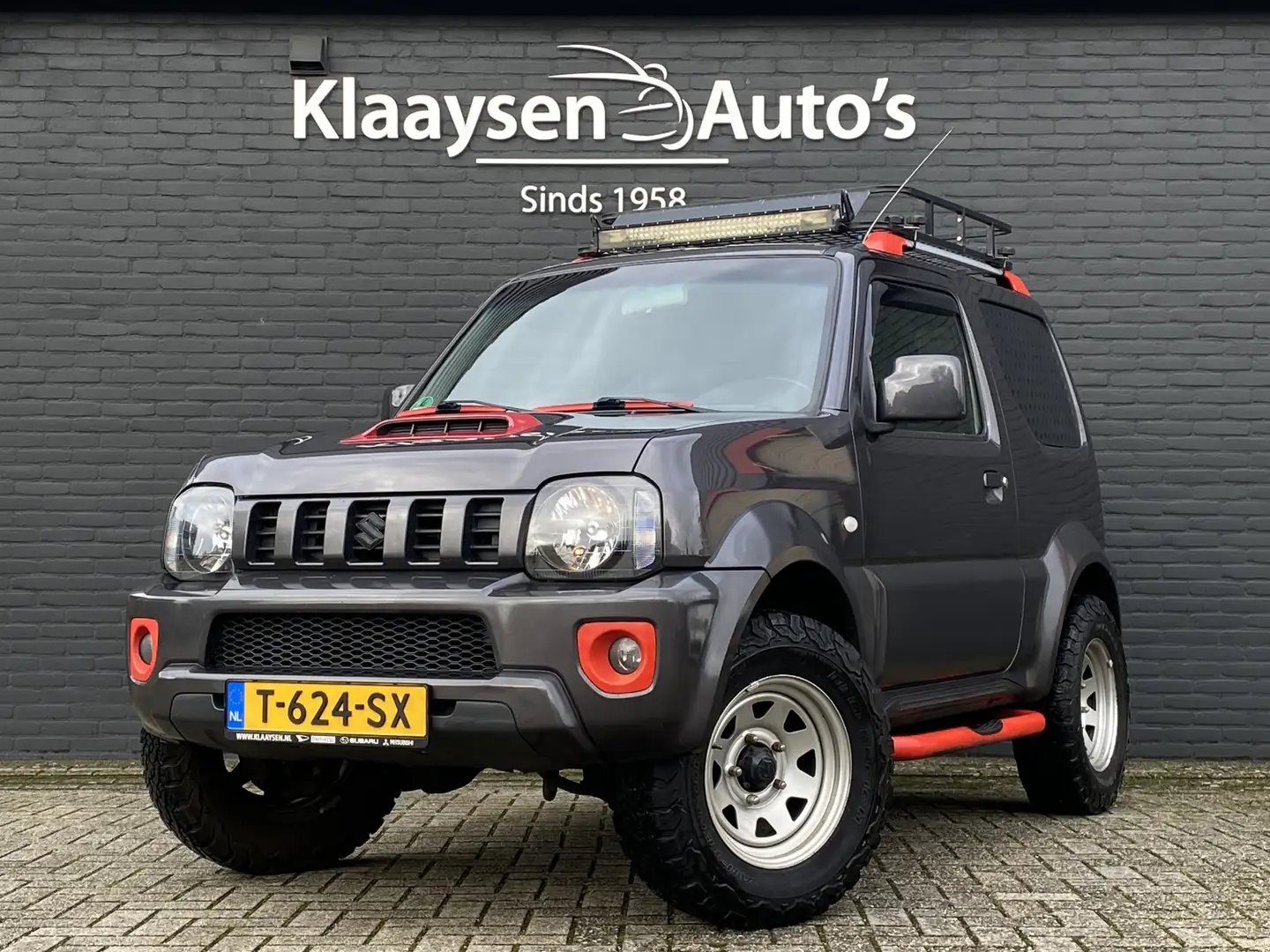 Suzuki Jimny 1.3 4WD Exclusive | leder interieur | airco | trek Grijs - 1