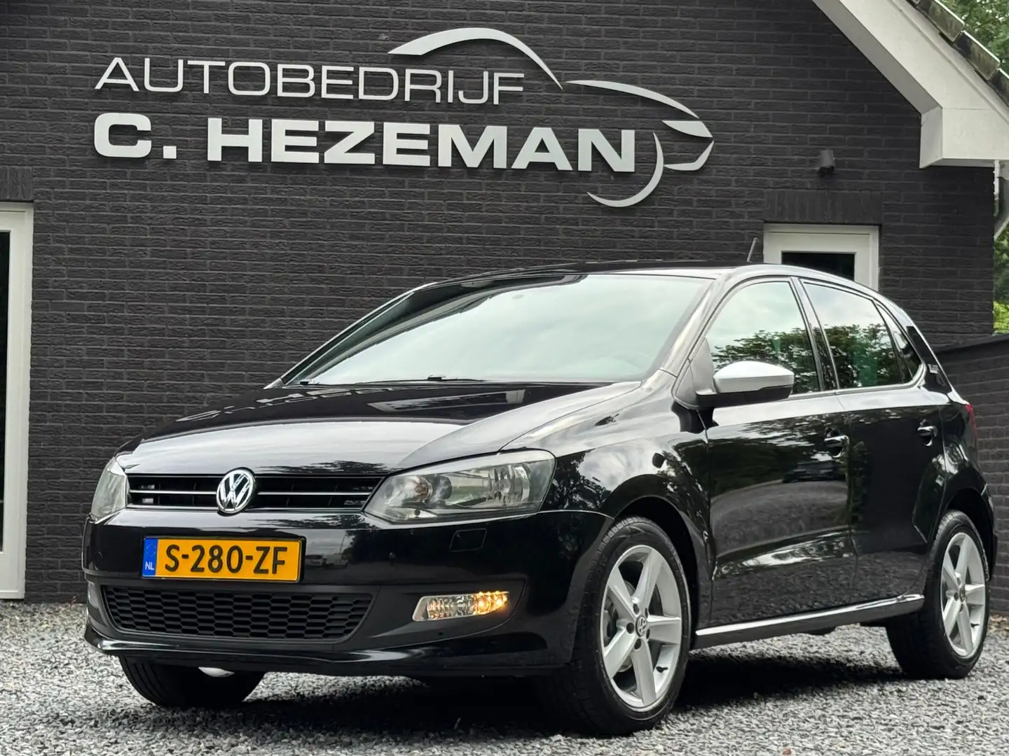 Volkswagen Polo 1.2-12V 70PK Black Edition Sportvelgen Airco 5 Deu Zwart - 1