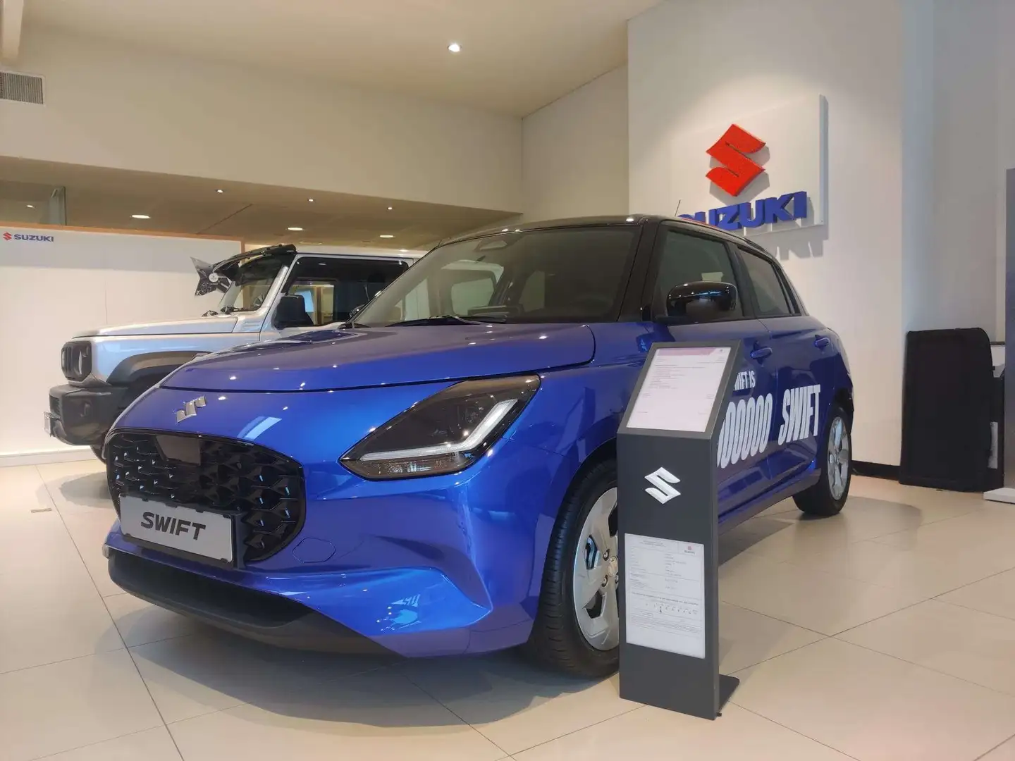 Suzuki Swift 1.2i HYBRIDE GL+ 12V MANUEEL Grijs - 1