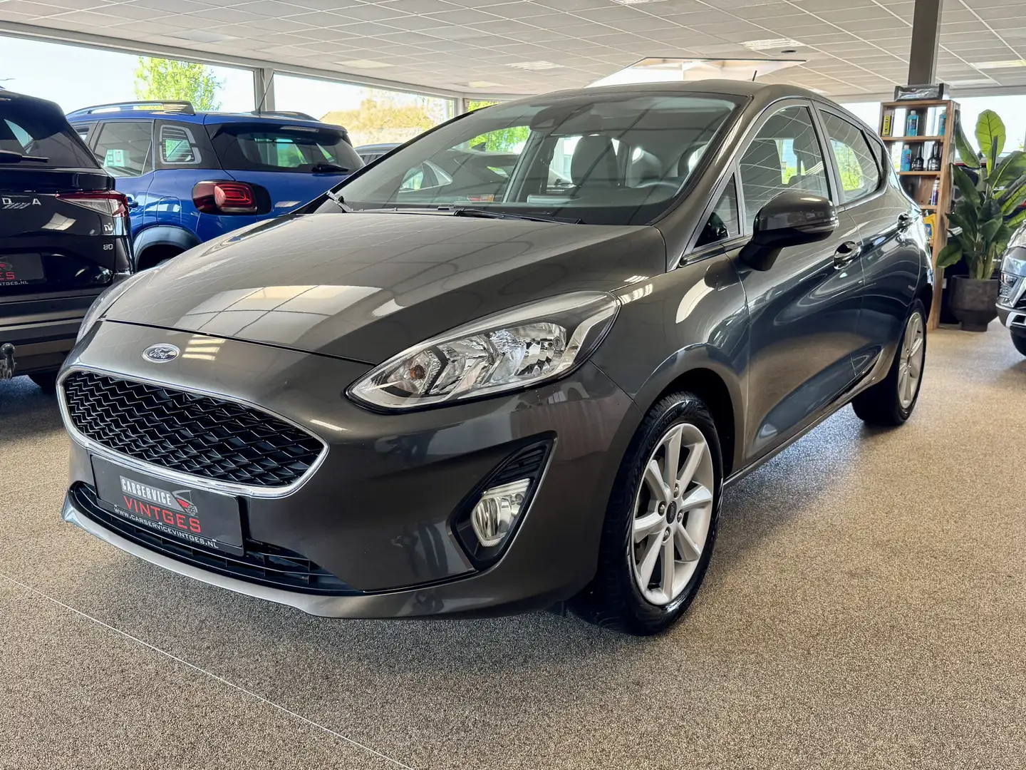 Ford Fiesta 1.1 style Cruise Control/NAVI/LMV/Airco Grijs - 1