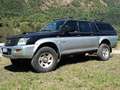 Mitsubishi L200 L200 d.cab 2.5 tdi GL 4wd 115cv Чорний - thumbnail 1