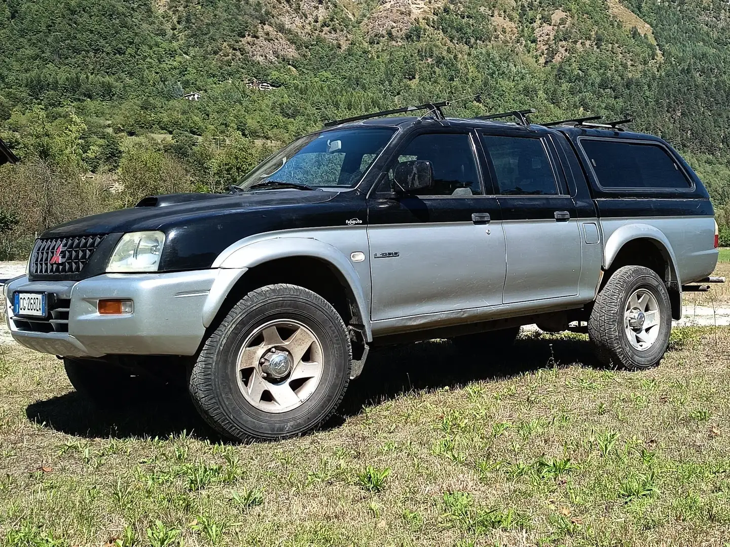 Mitsubishi L200 L200 d.cab 2.5 tdi GL 4wd 115cv Чорний - 1
