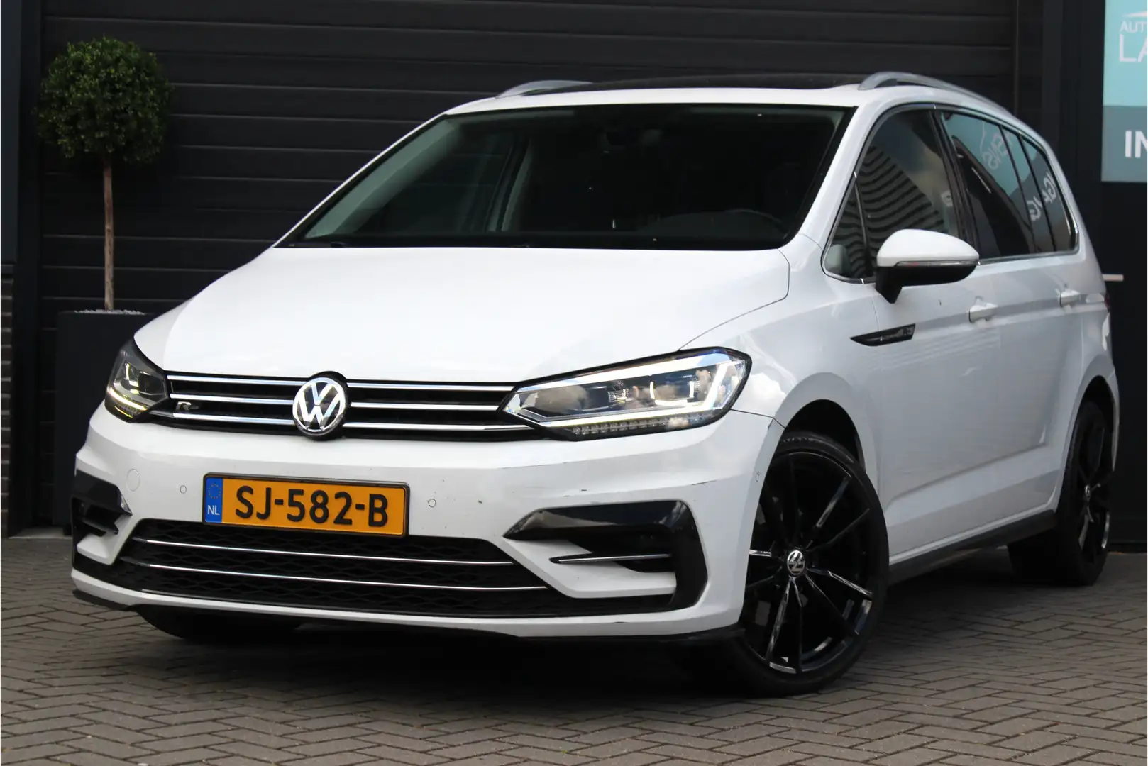 Volkswagen Touran 1.4 TSI Highline Business R | 7-Pers. | Pano | Cam Wit - 1