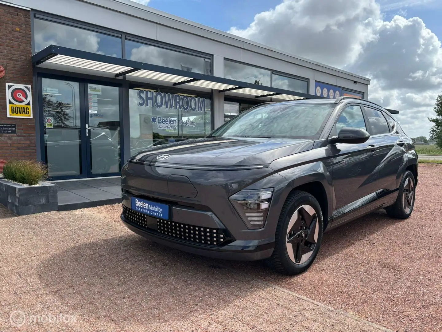 Hyundai KONA Electric Comfort Smart 65.4 kWh | Warmtepomp | Tre Grigio - 1