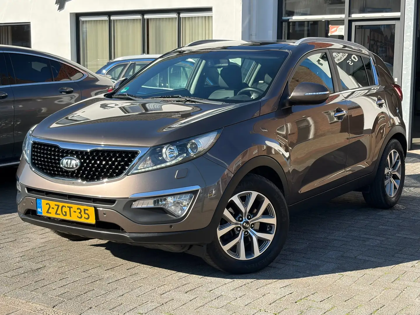 Kia Sportage 1.6 GDI ExecutiveLine, Schuif/kanteldak, Stoelverw Bruin - 1