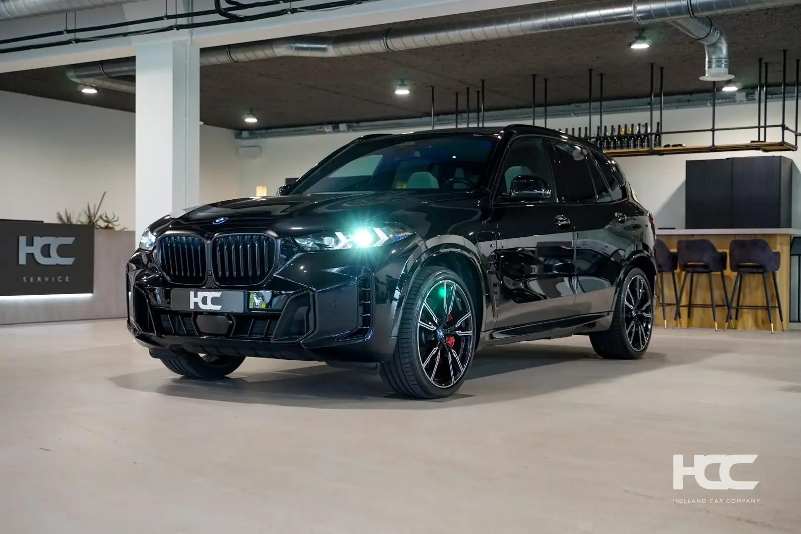 BMW X5 xDrive50e M Sport Pro | 22 inch | Pano | SoftClose Zwart - 1