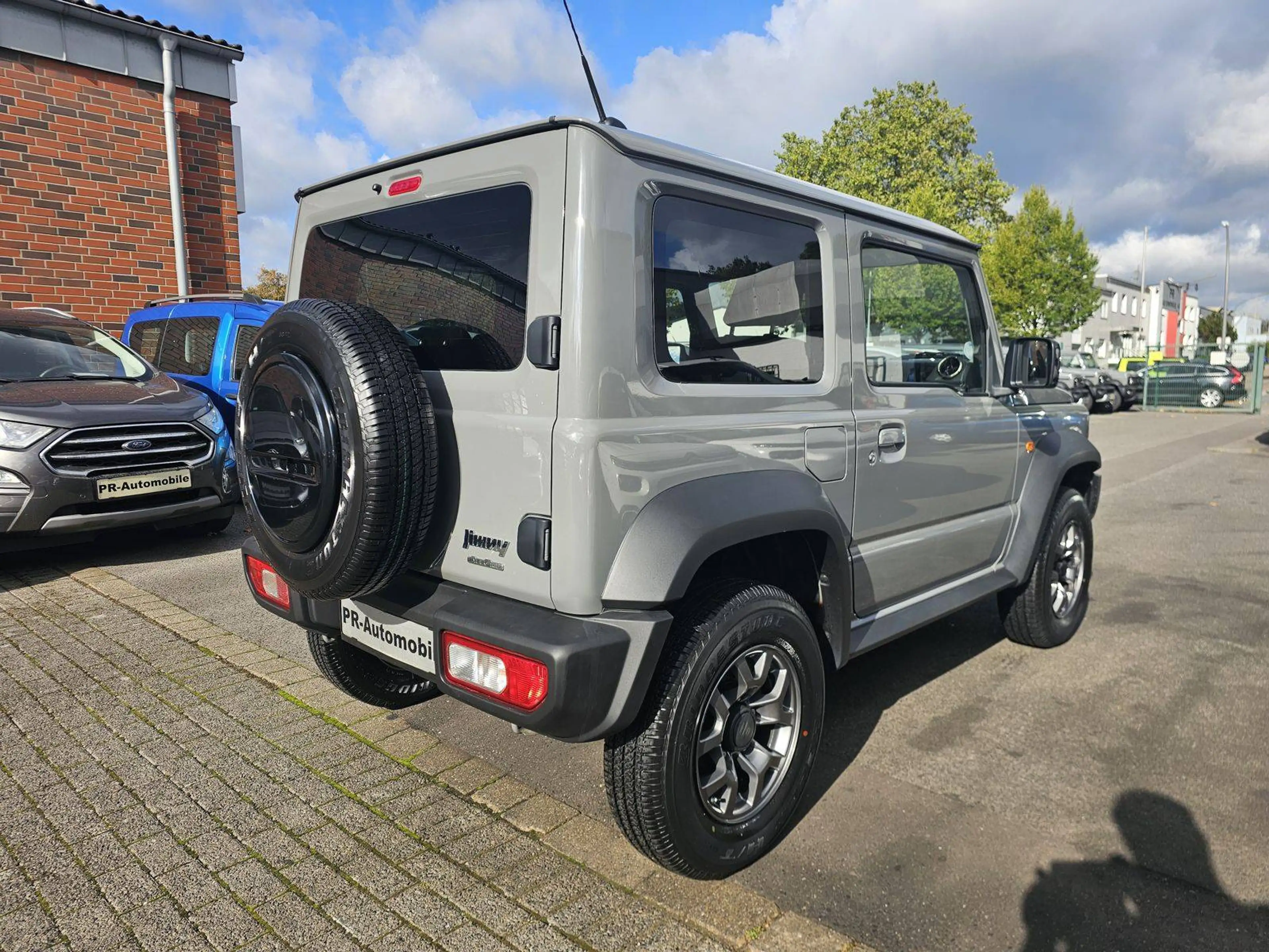 Suzuki Jimny Comfort+ AllGrip Klimaaut/Navi+Cam/Alu — photo 4