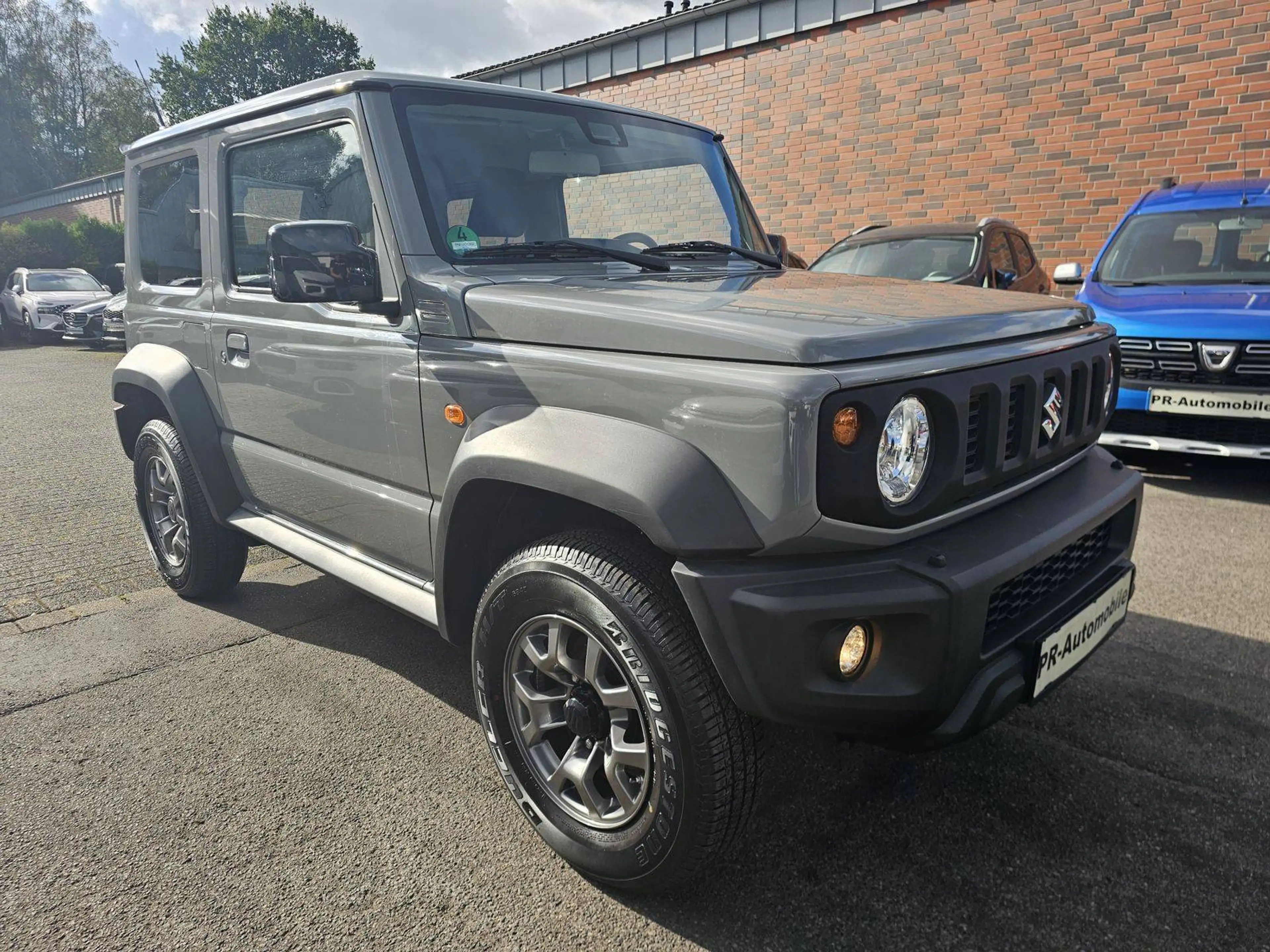 Suzuki Jimny Comfort+ AllGrip Klimaaut/Navi+Cam/Alu — photo 3