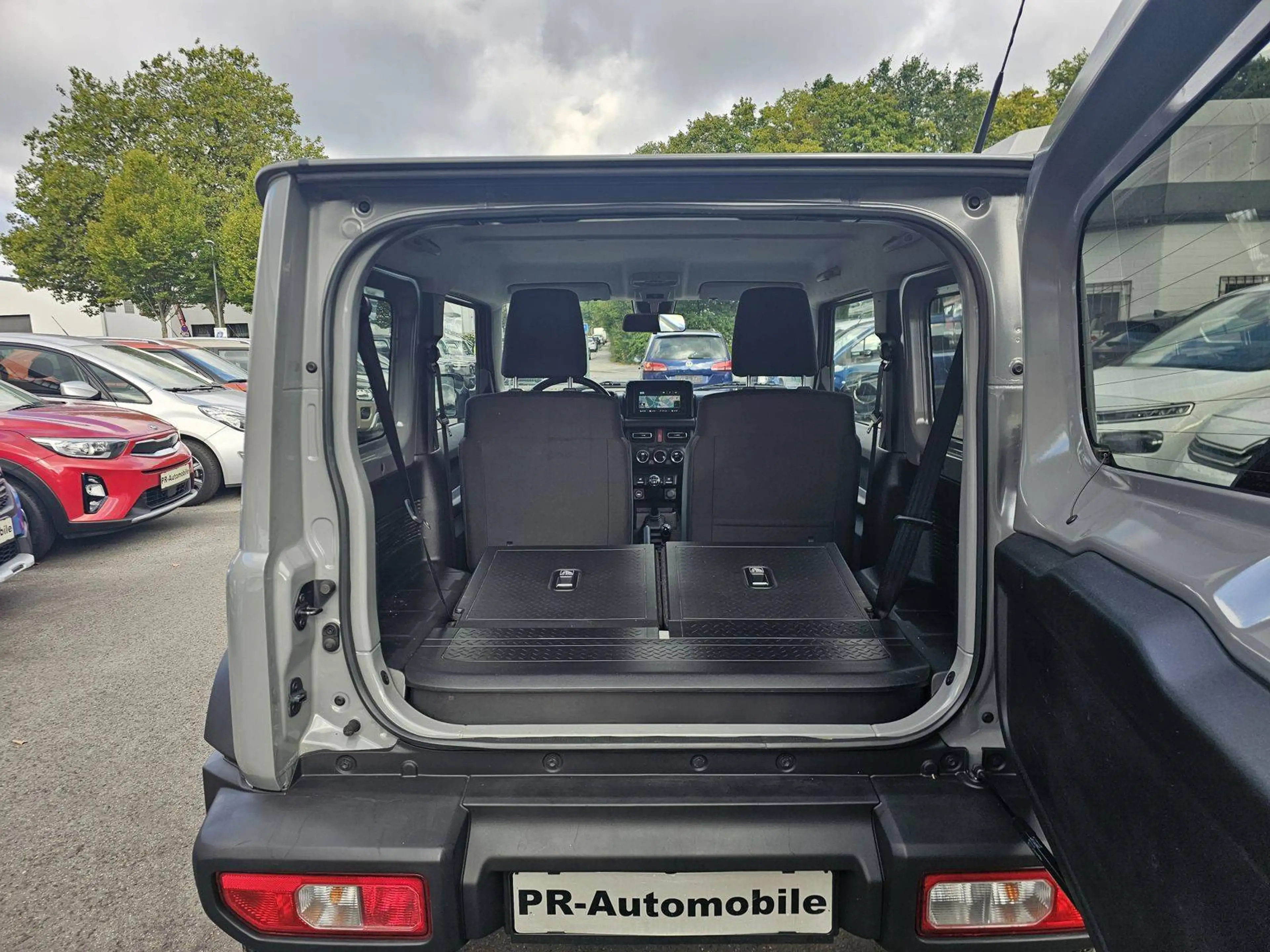 Suzuki Jimny Comfort+ AllGrip Klimaaut/Navi+Cam/Alu — photo 11