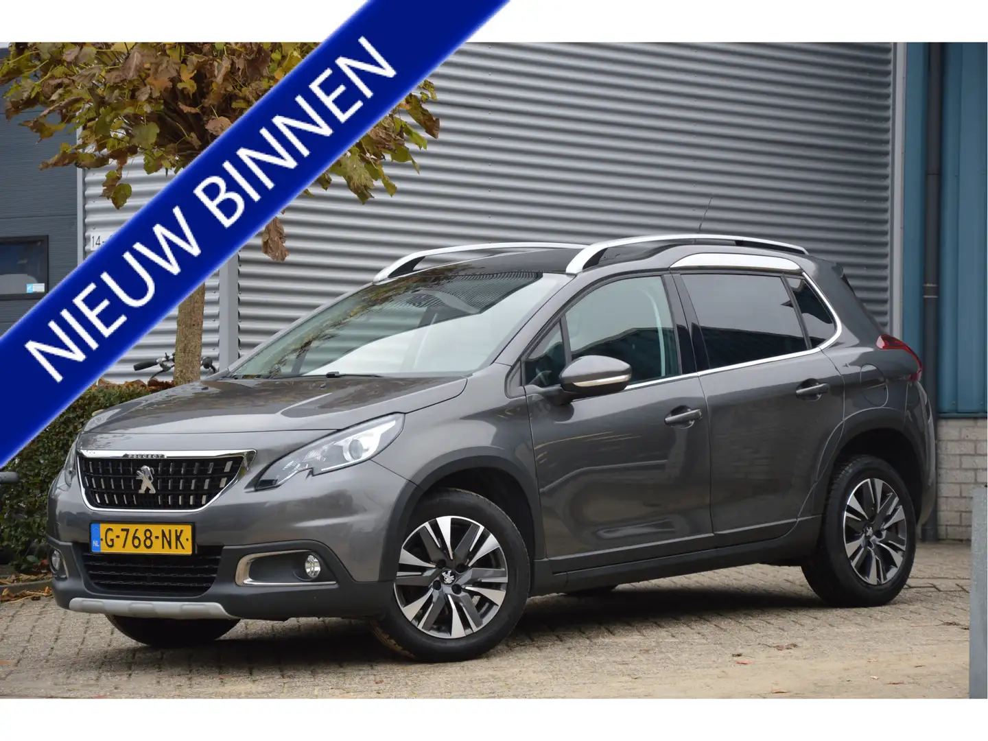 Peugeot 2008 1.2 PureTech Allure AUTOMAAT | PANORAMADAK | CLIMA Grau - 1
