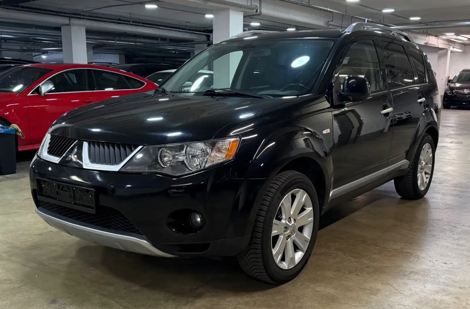 Mitsubishi Outlander 2.4 Automatik 7-Sitzer~Leder~Navi~Klima Schwarz - 1