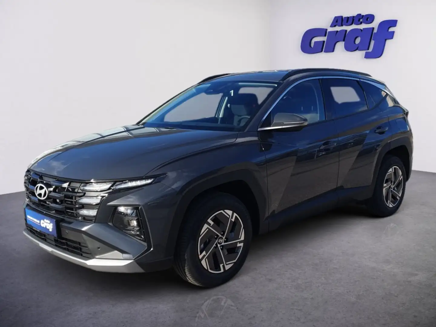 Hyundai TUCSON 1,6 T-GDI HEV 4WD Jubilé Aut. Grau - 1