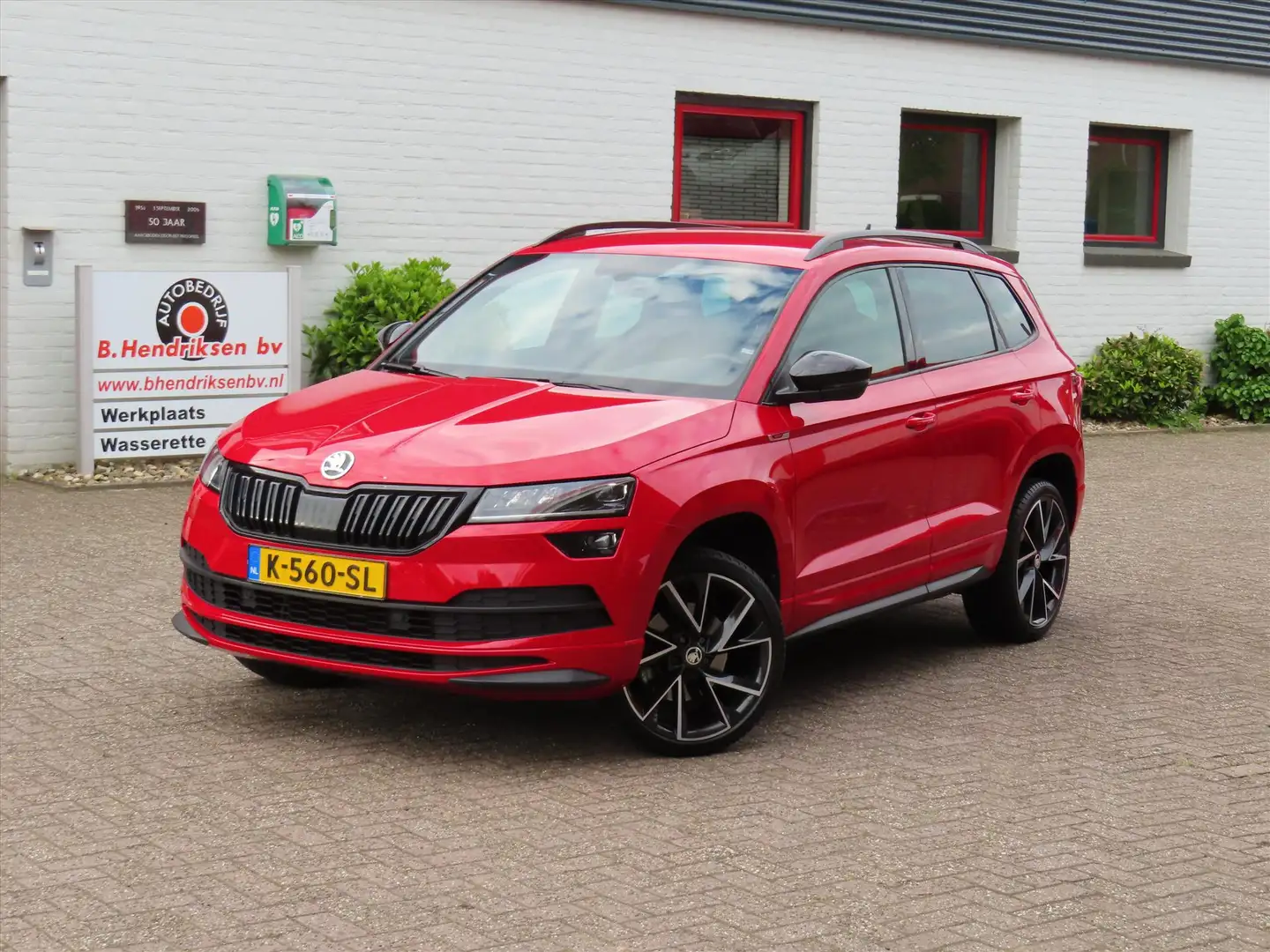 Skoda Karoq 1.5 TSI ACT Greentech 150pk DSG-7 Sportline Busine Rojo - 1