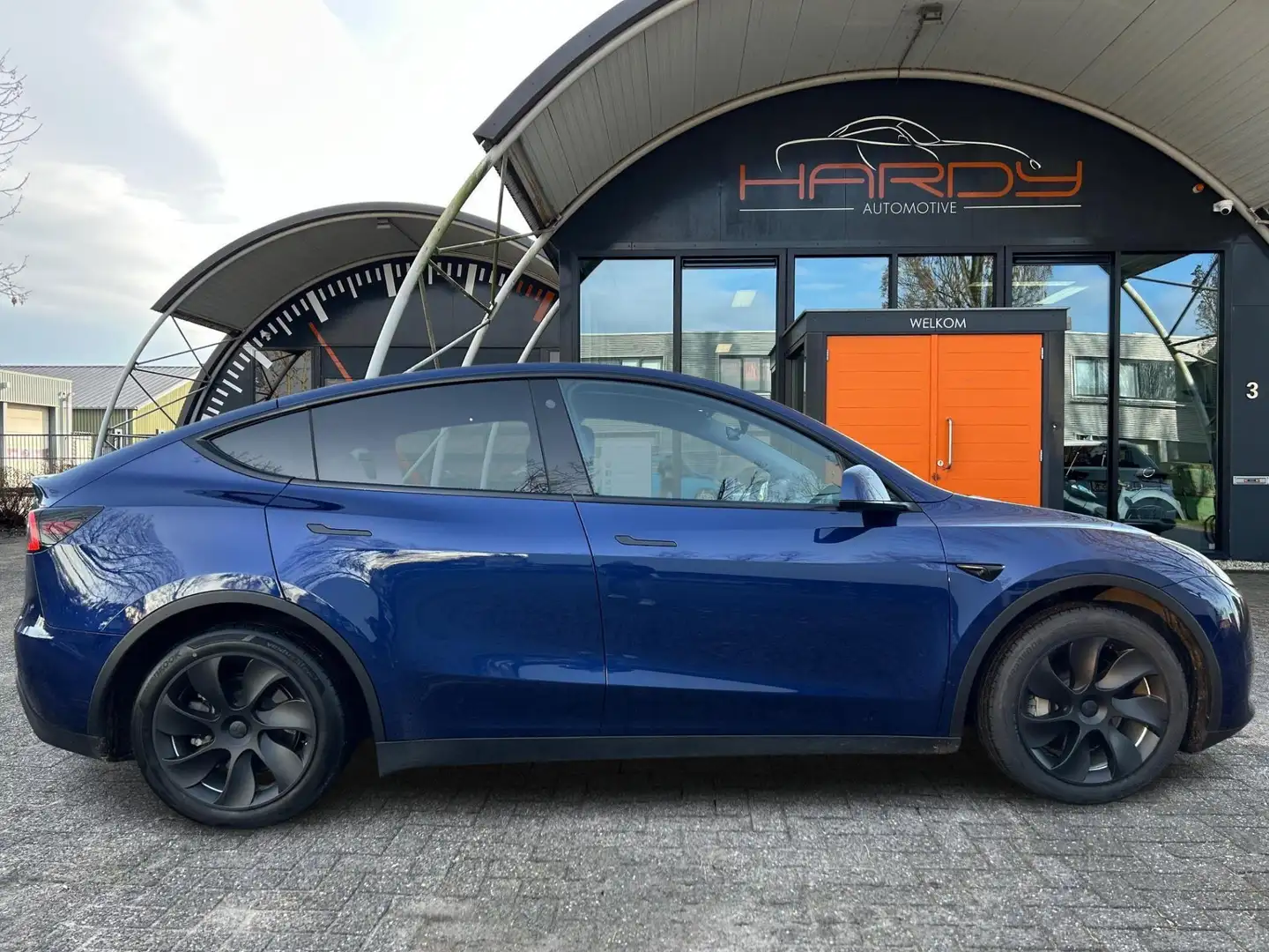Tesla Model Y RWD 58 kWh 95% SOH Trekhaak BTW Auto 1e EIG Rijkla Blauw - 2