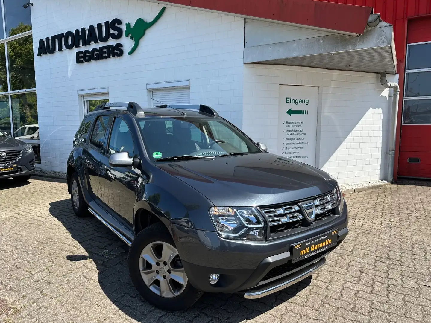 Dacia Duster I Prestige 4x2/NAVI/SHZ/AHK/1HD/KAM/TEMP Grau - 1