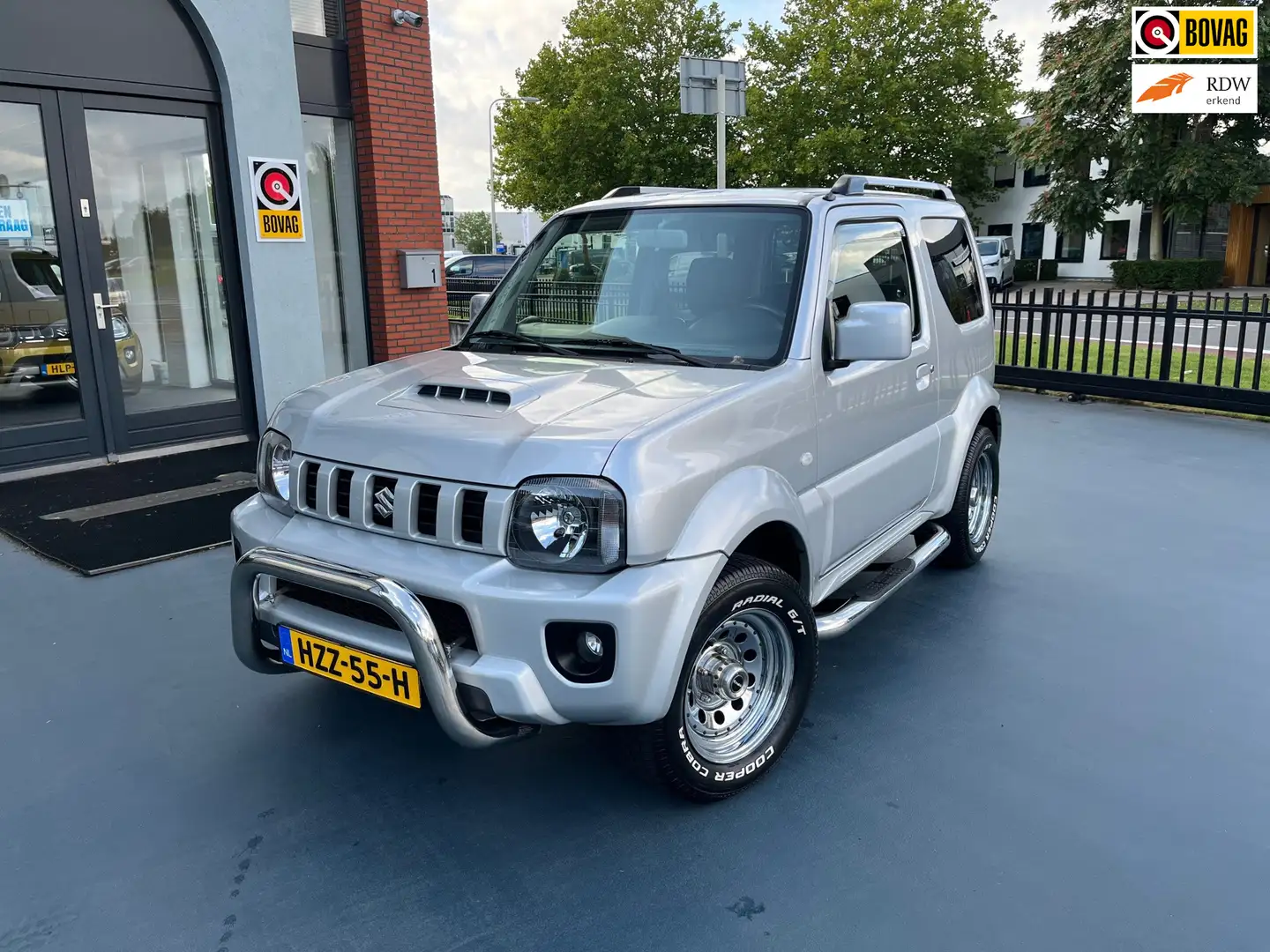 Suzuki Jimny 1.3 Exclusive AIRCO 4X4 LEDER STOELVERWAMING Gris - 1